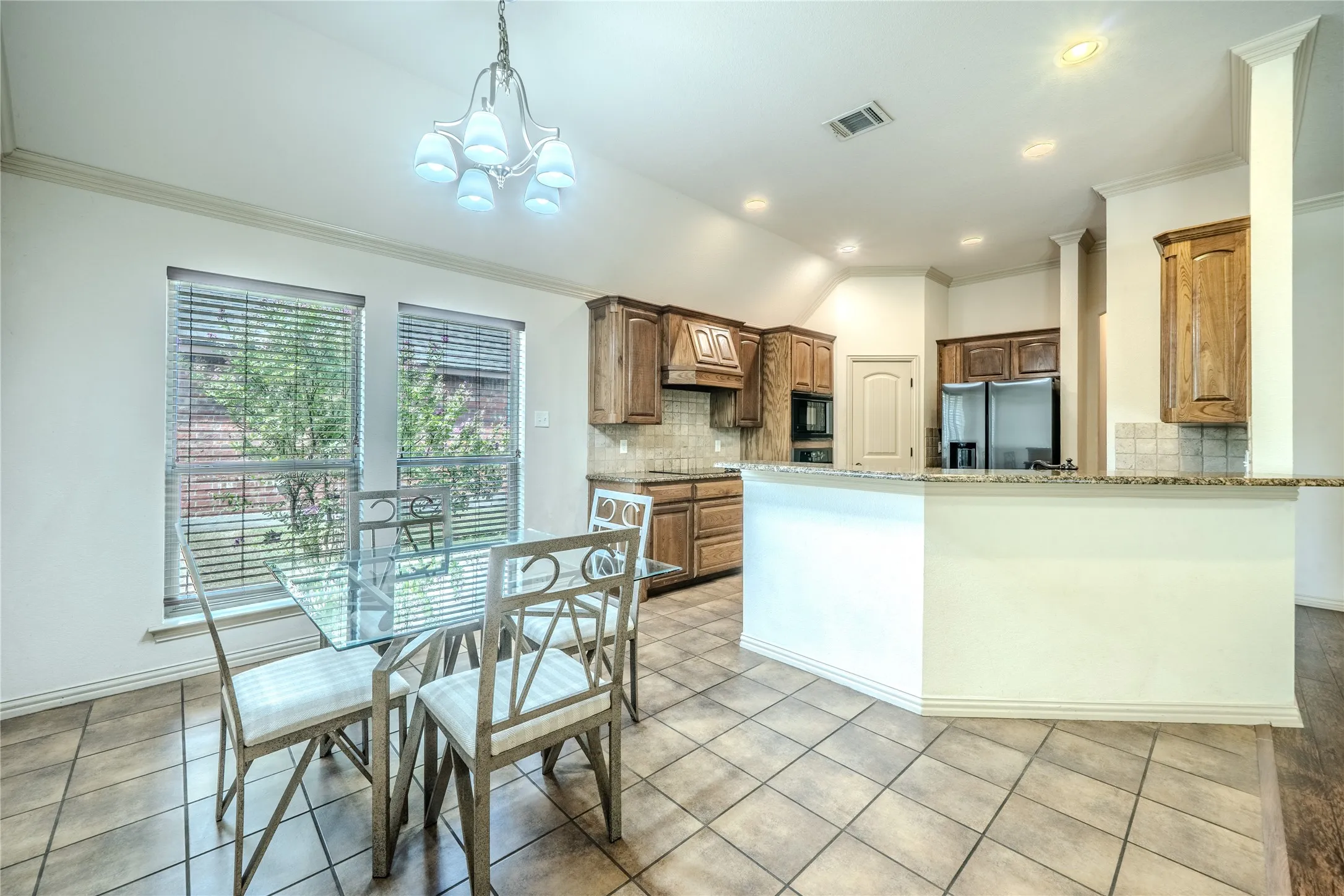 Dining area is open to breakfast bar and kitchen,