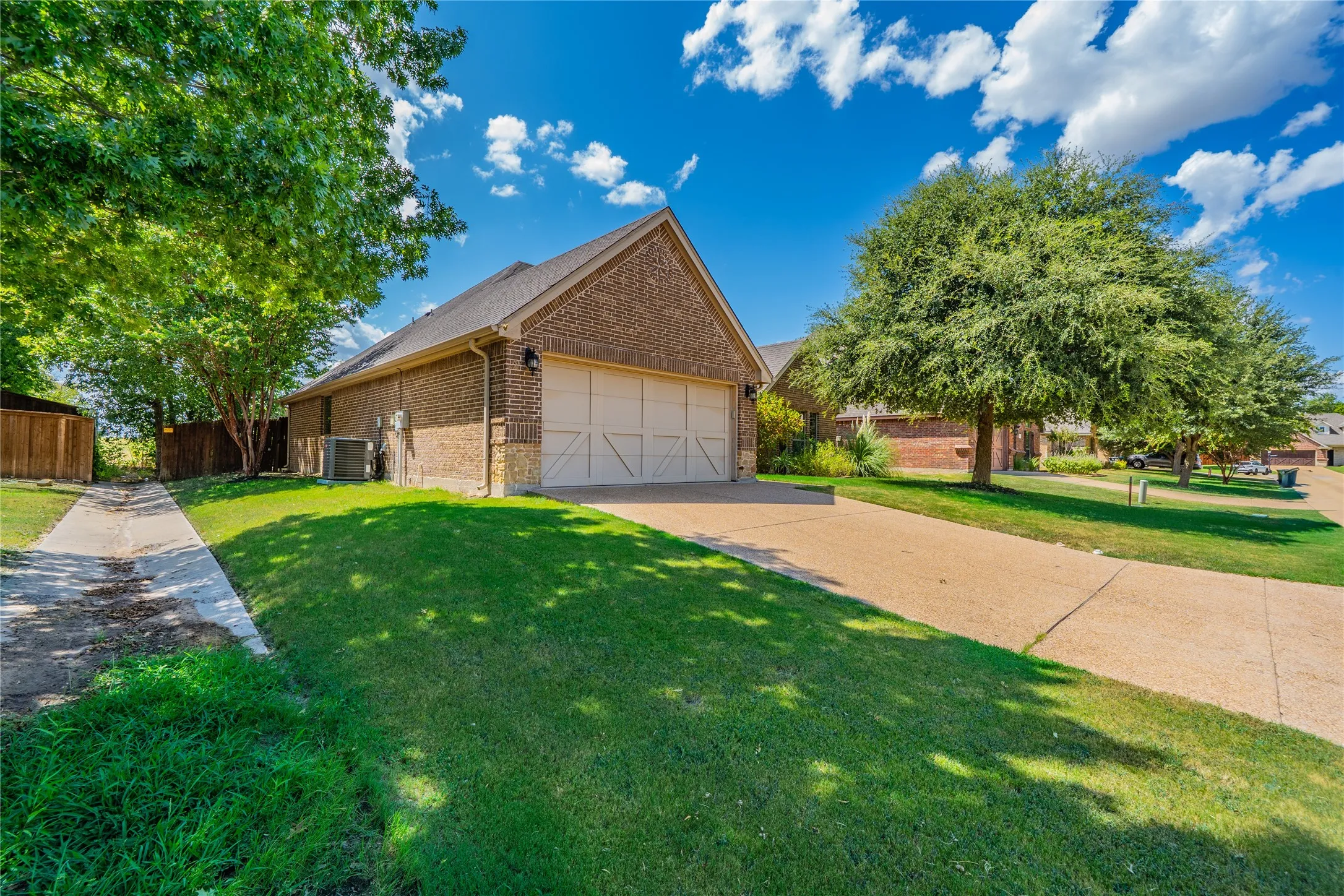 Front entry garage with decorative design.