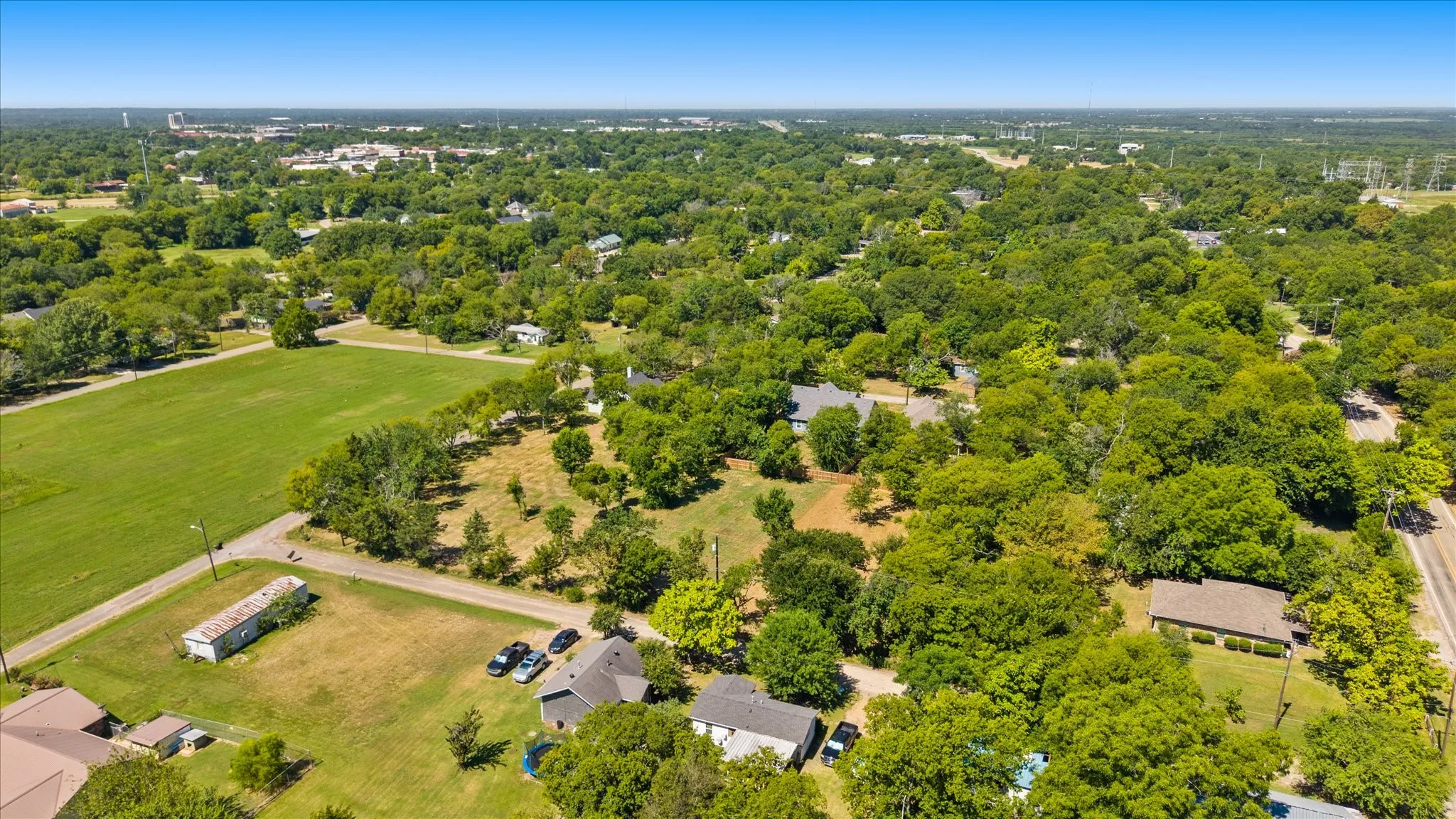 Expansive acreage offering a mix of cleared land and mature trees