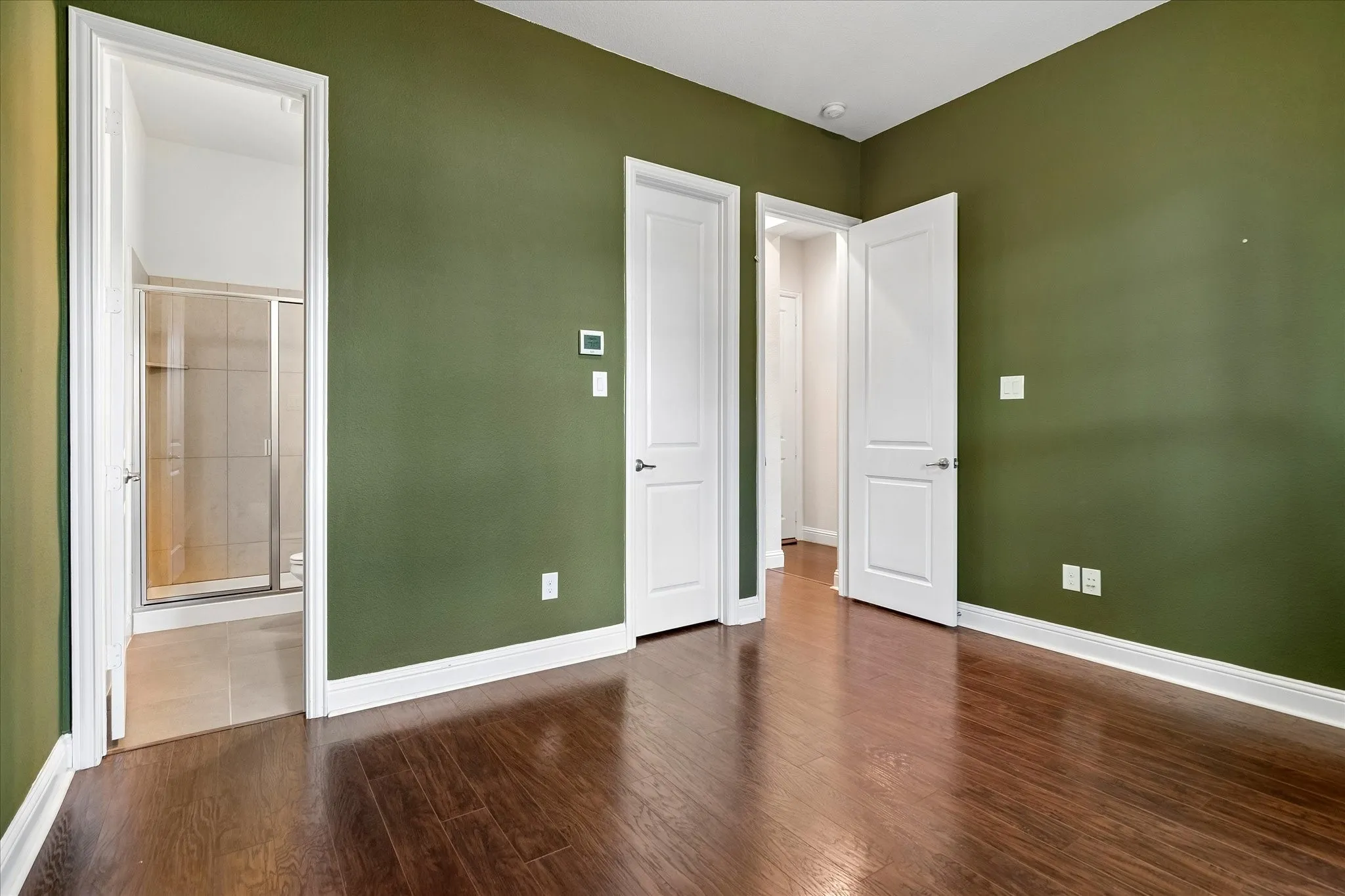 Rich wood-finish flooring with crisp white trim