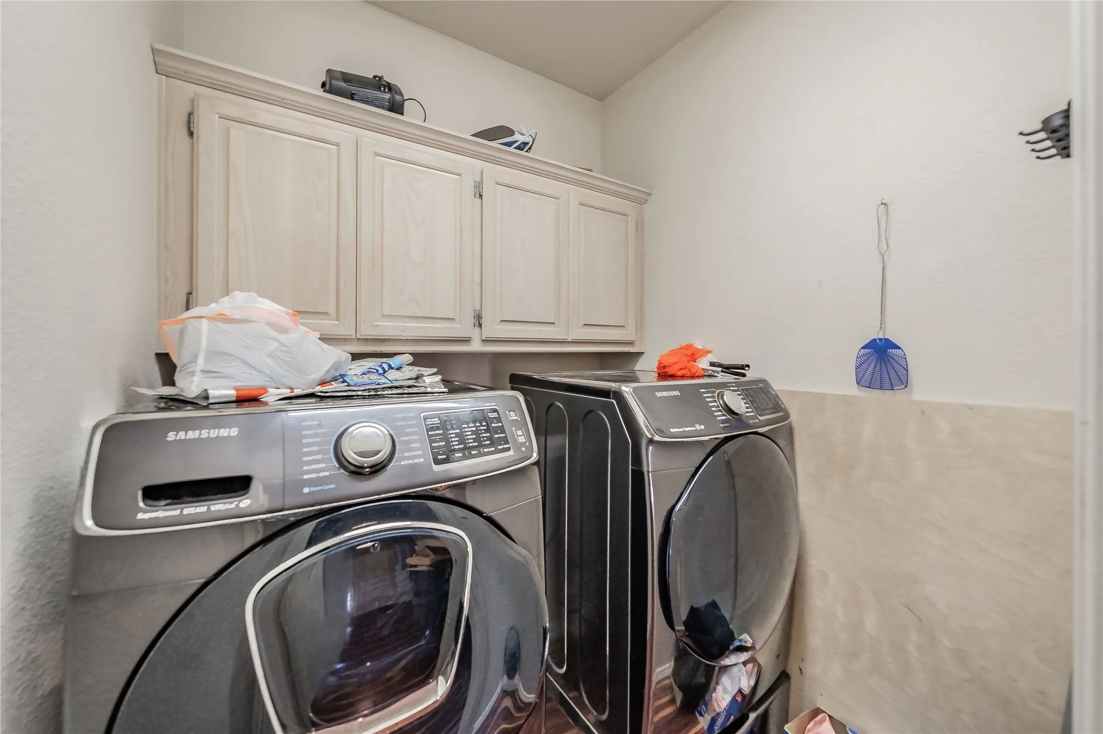 Upper cabinetry with recessed panel doors