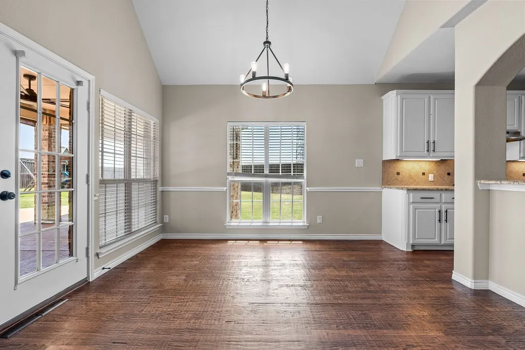 Vaulted ceiling with an updated chandelier