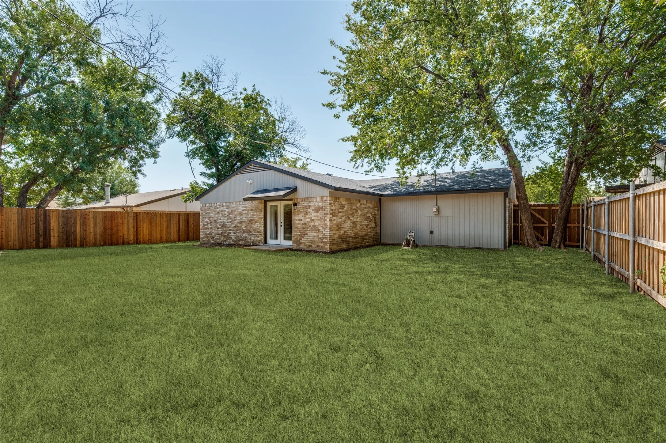 Expansive green lawn with a full privacy fence.  Two sides of the fence are brand new as well as two new gates!  Your backyard is a blank canvas just waiting for your creativity!