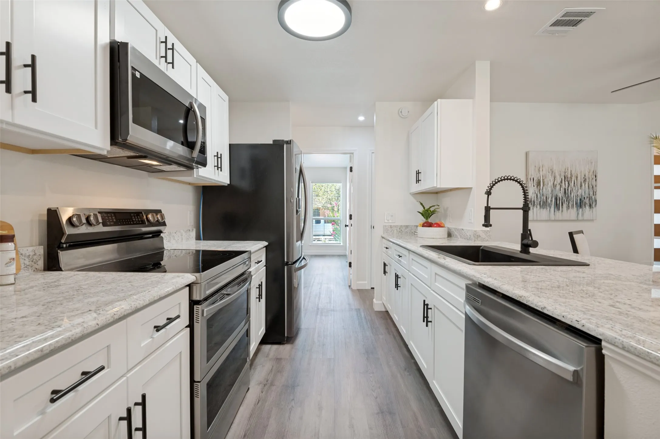 The LVP flooring is throughout the whole house making any spills easy peezy to clean up!