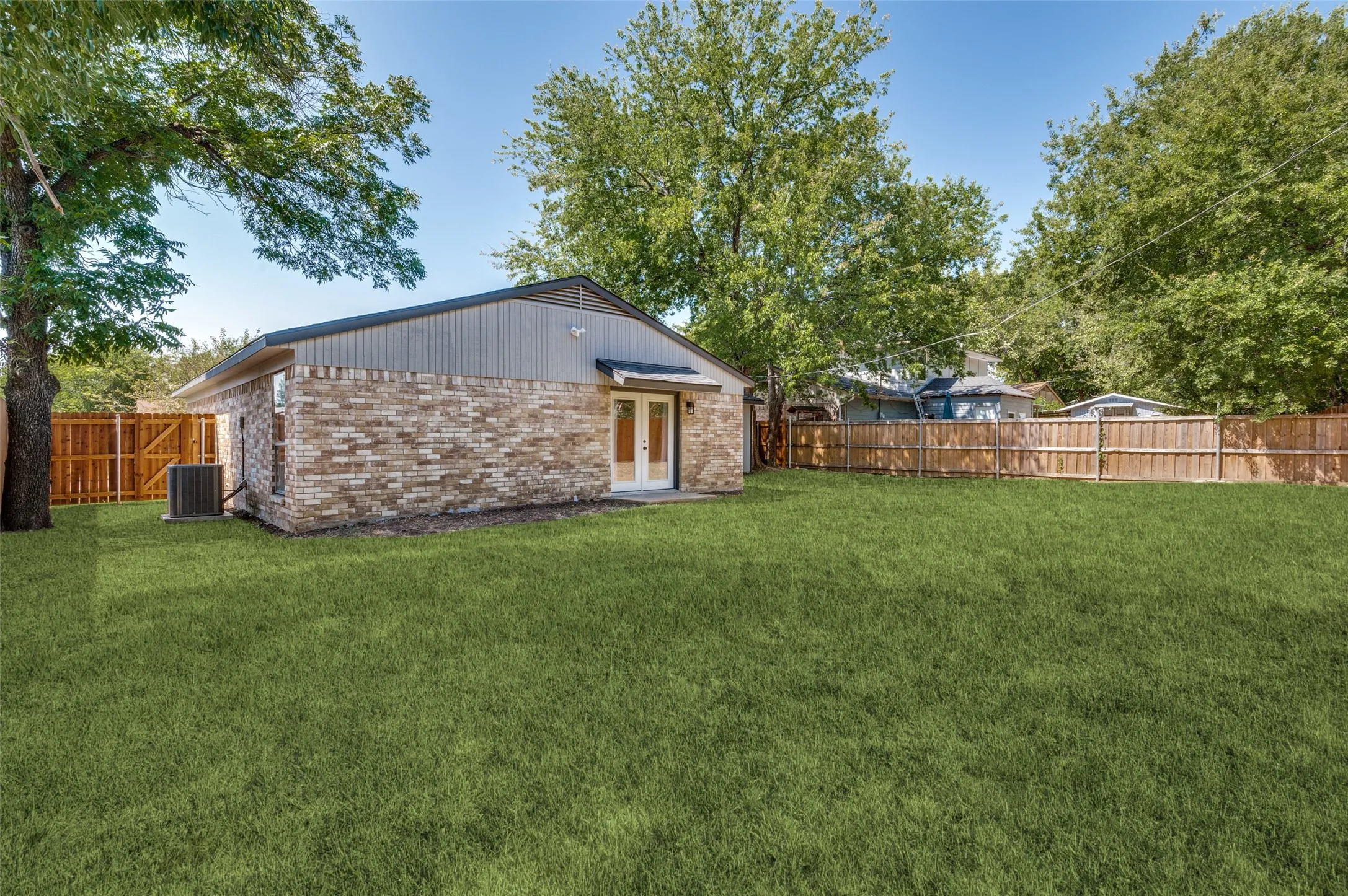 Your beautiful French doors open up to the patio with an awning.  Just imagine if you poured a bigger patio and added a pergola with a fan and misters!  Why stop there?  How about adding a pool and an outdoor kitchen?  Its spacious enough for all of it!