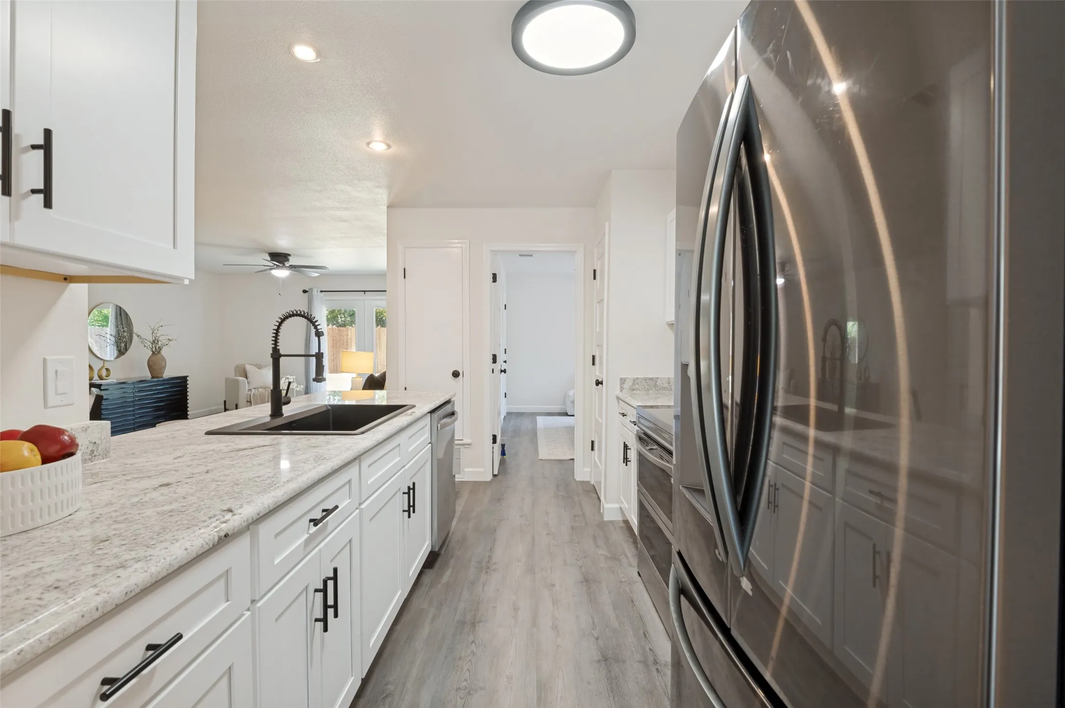 The view from one end of the kitchen to the other!  All new appliances except for the fridge.