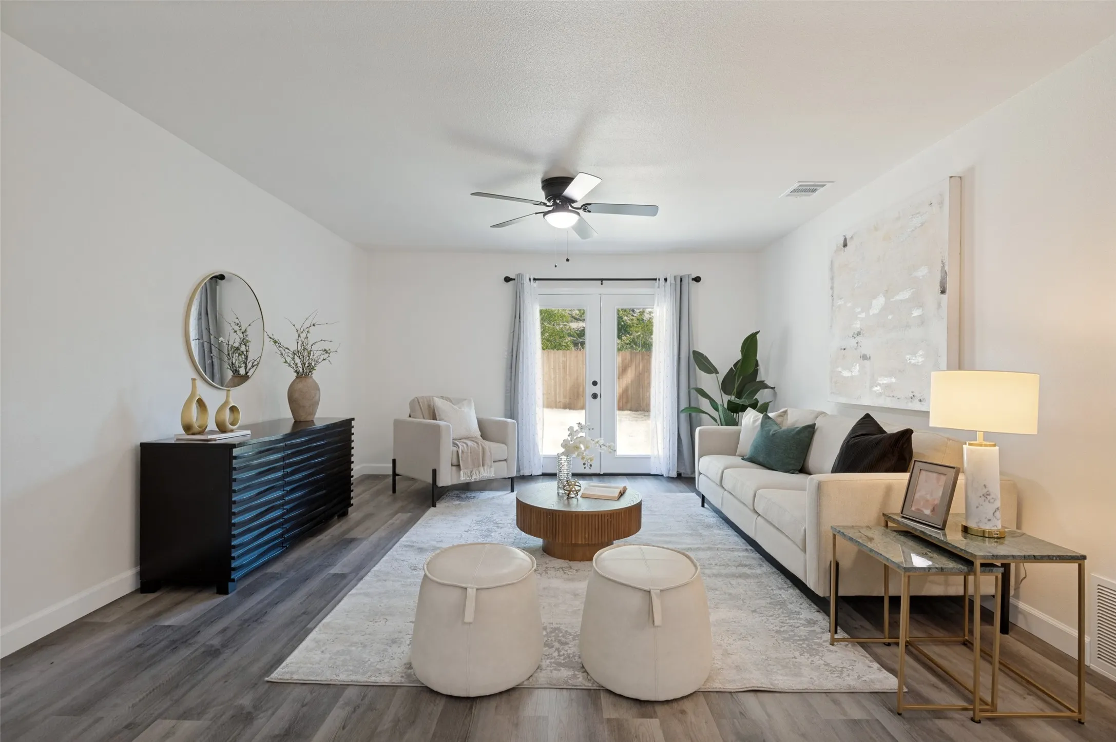 The spacious living area flows from the dining room to the outdoors.  Great entertaining space!