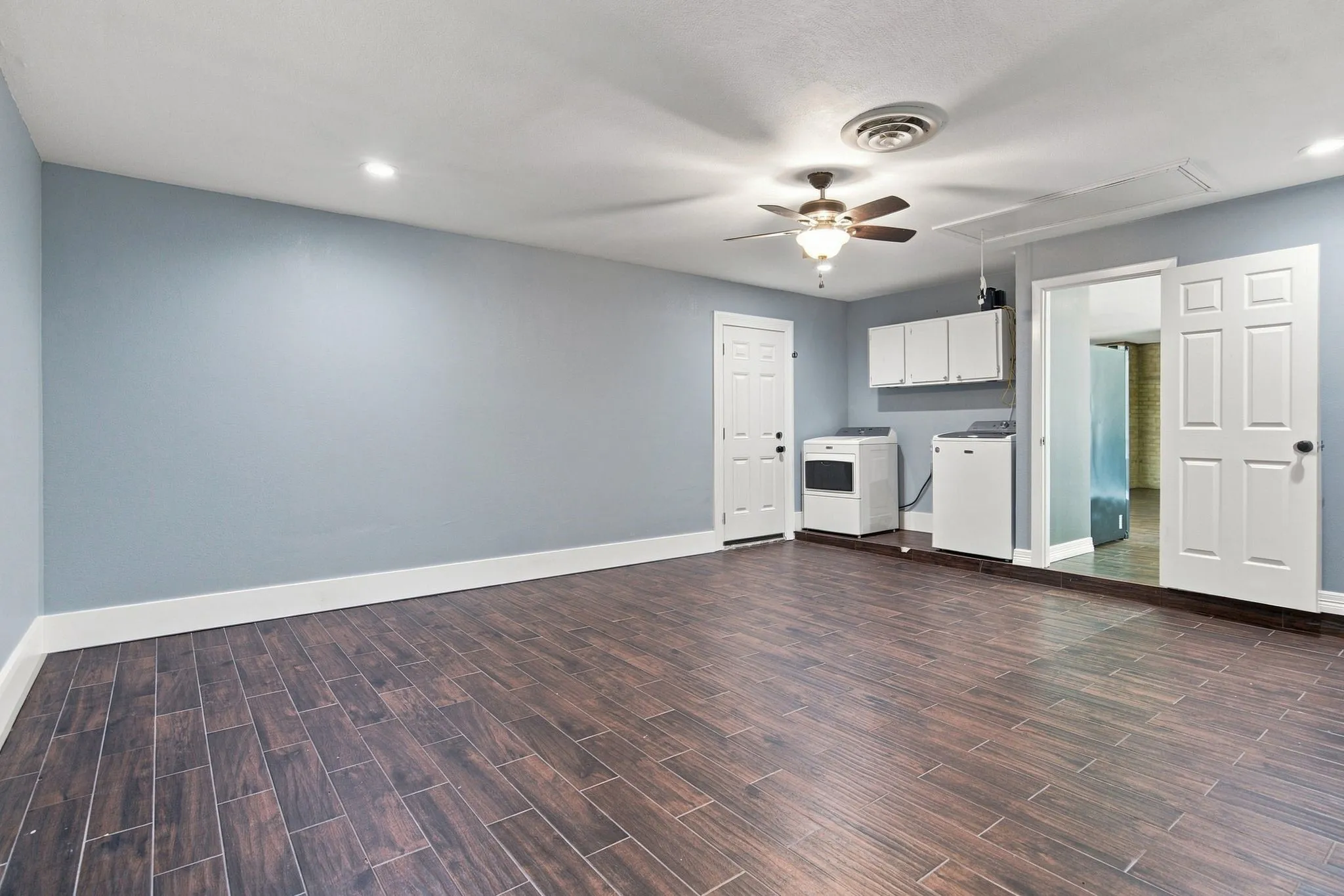 Bonus room and Laundry area. Door leading to the carport area