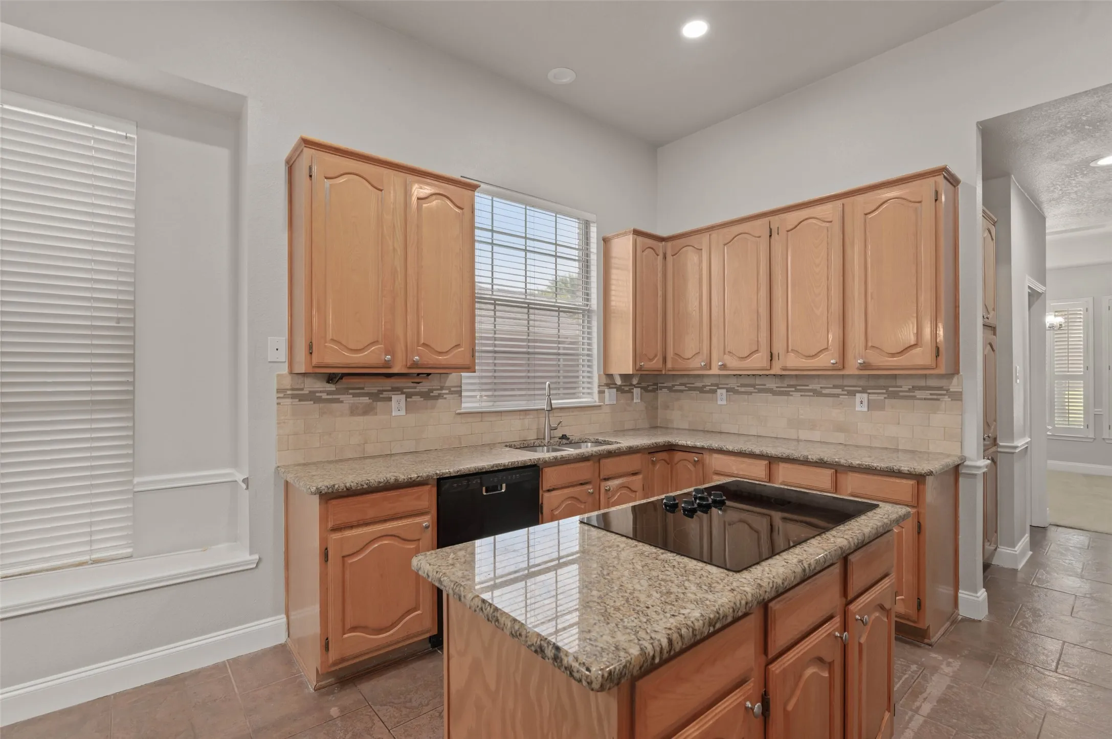 Spacious kitchen with granite countertops and plenty of counter space.