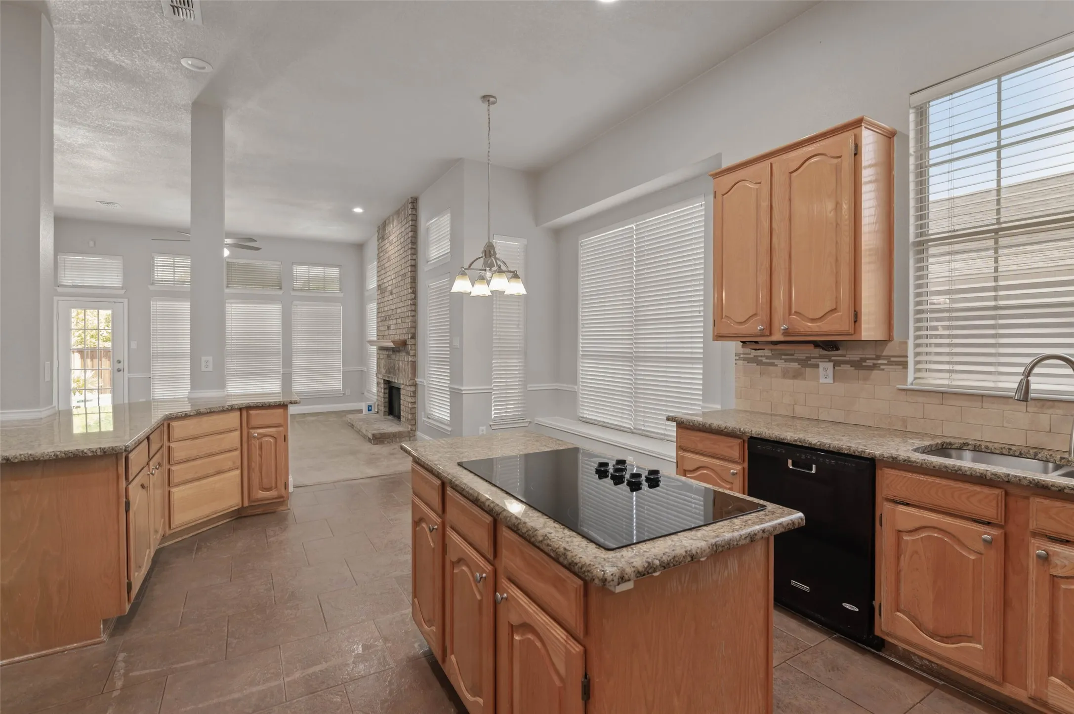 View from the kitchen into the living area.  This open floor plan includes a breakfast area.
