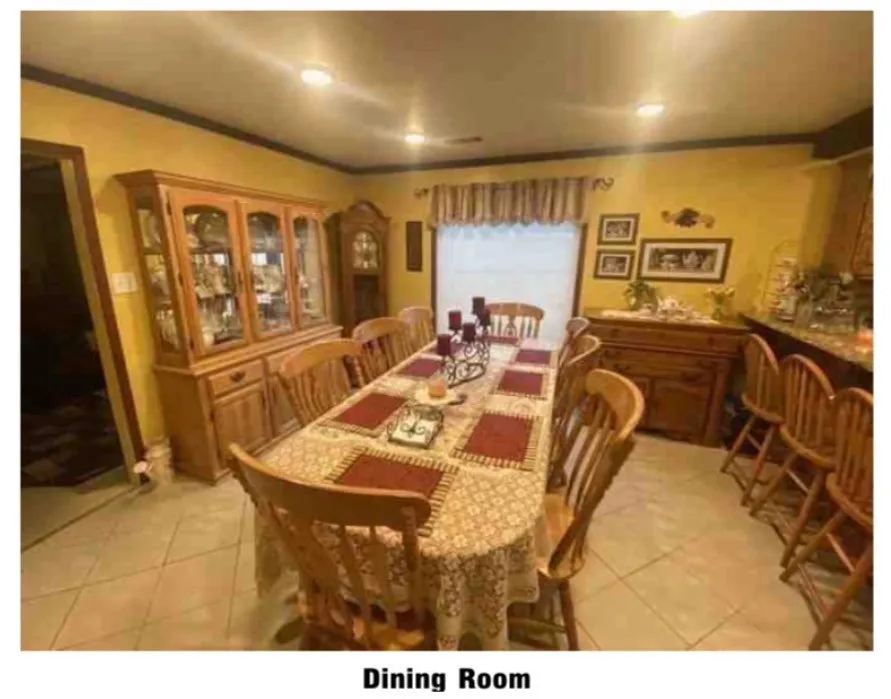Recessed ceiling lighting, tiled flooring, and a window with valance
