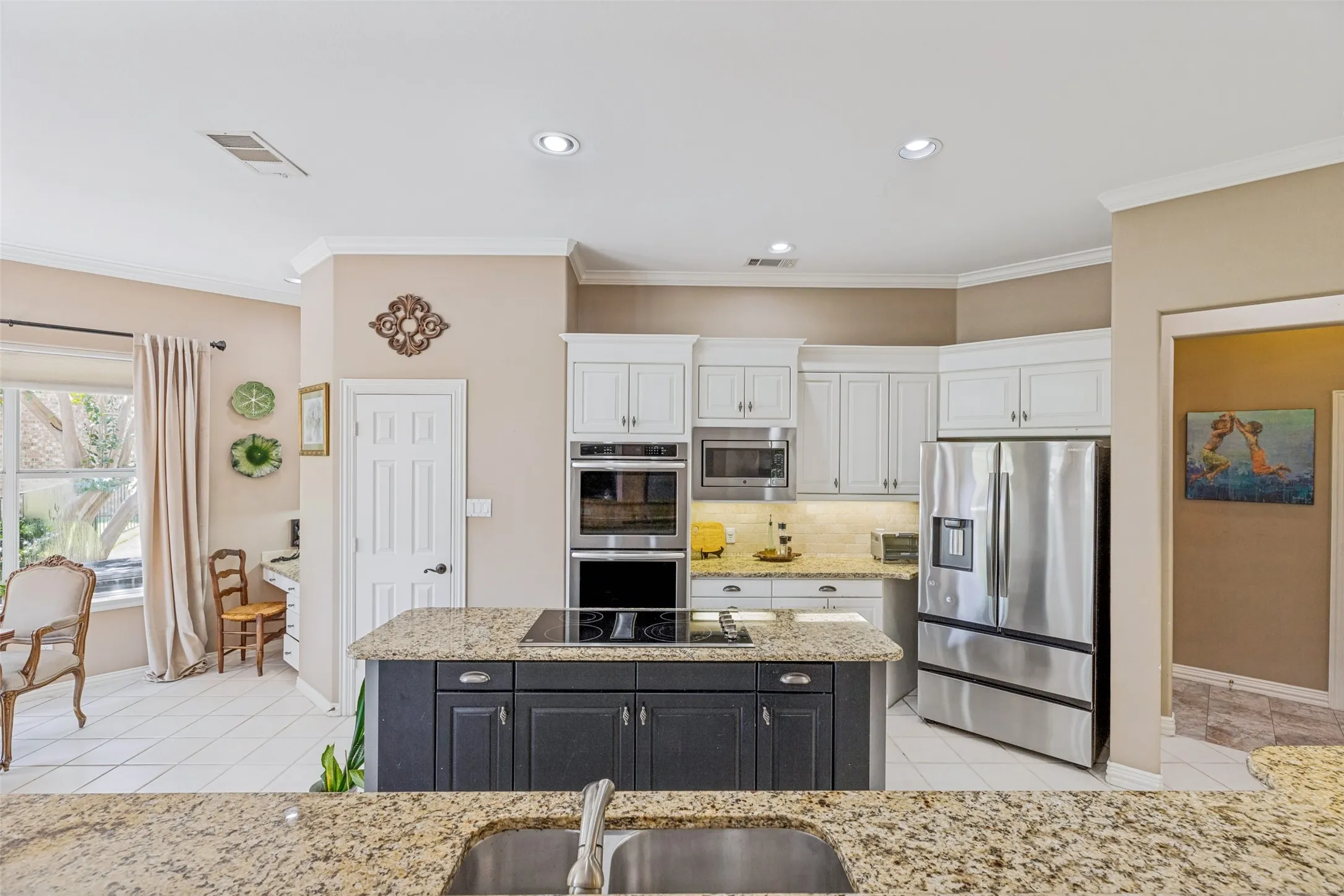 Great space and flow in this kitchen with SS appliances and double ovens.