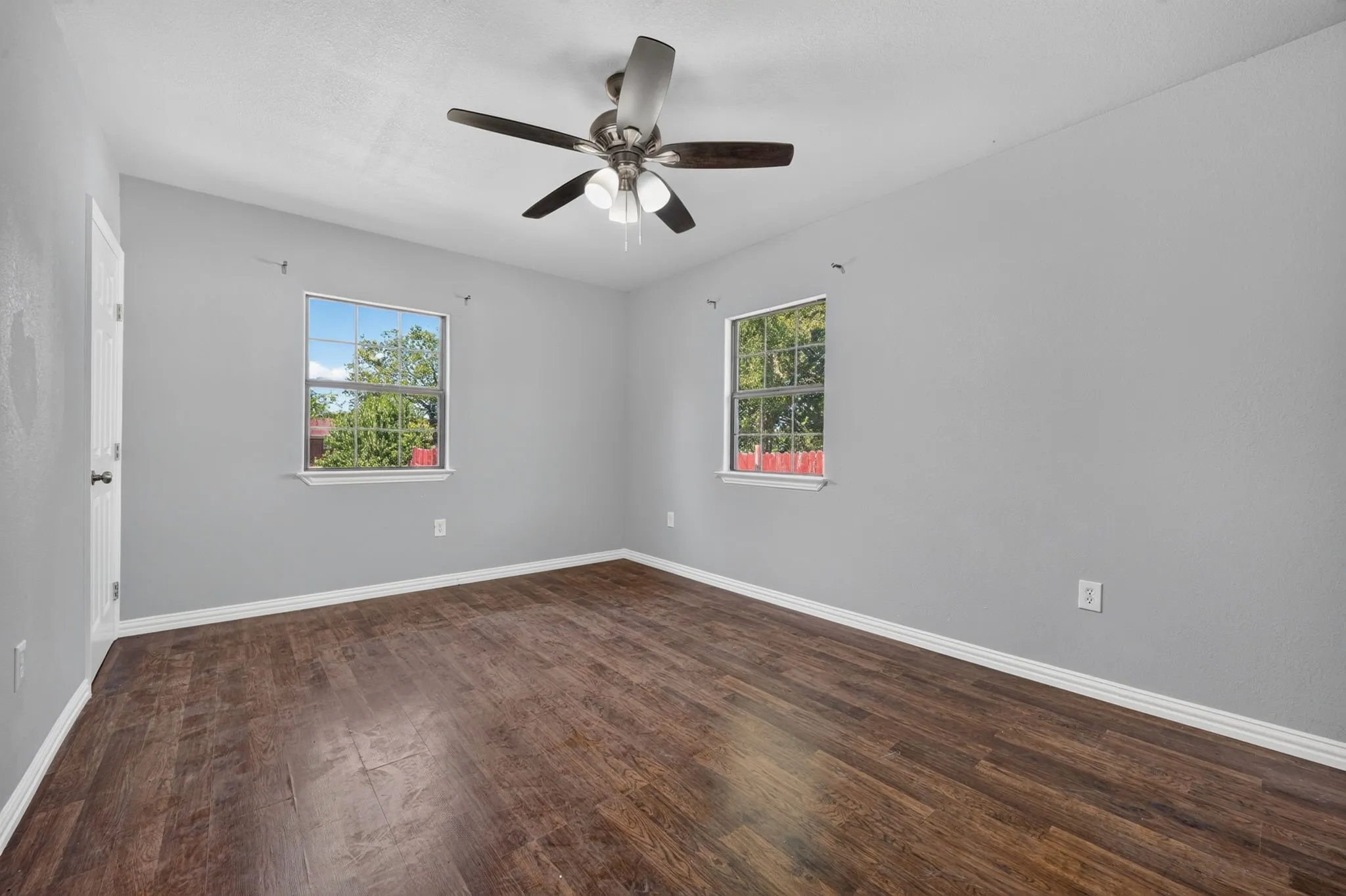 Dark wood look-finish flooring with light gray walls