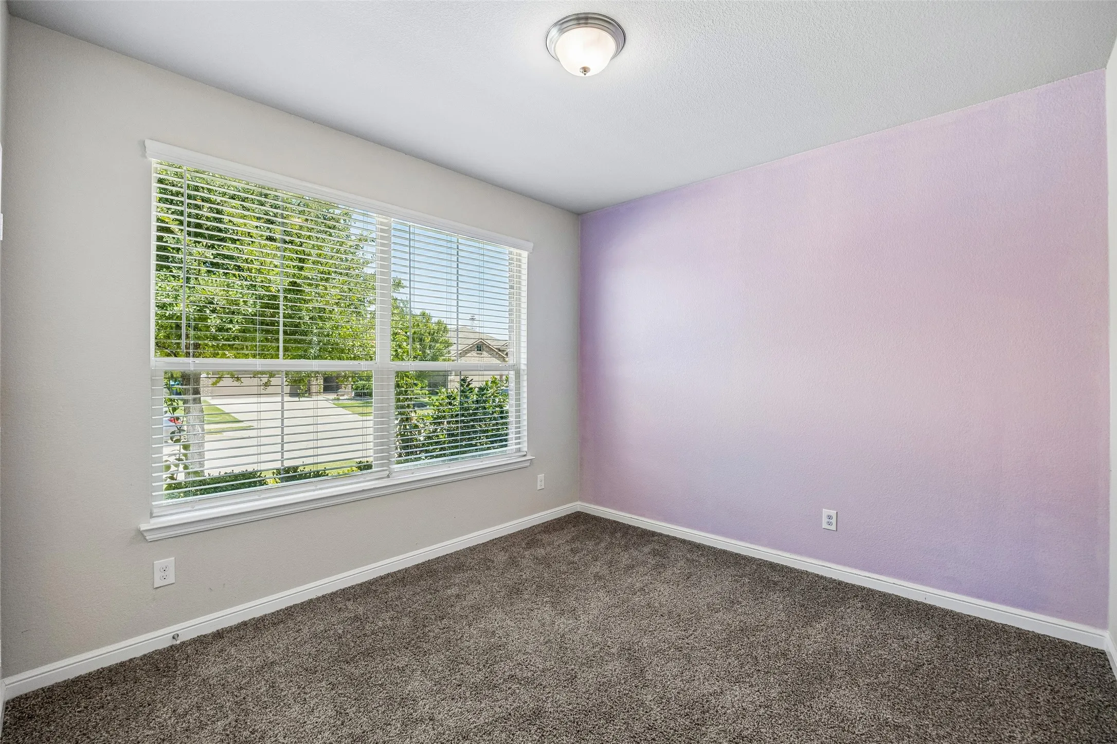 Guest bedroom #2 located at front of the home with full bathroom just outside