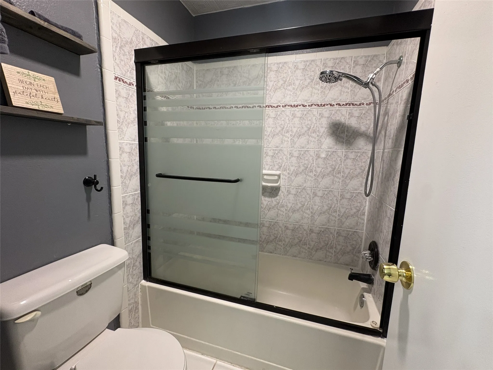A door from the master bath opens to the private & updated bath area.