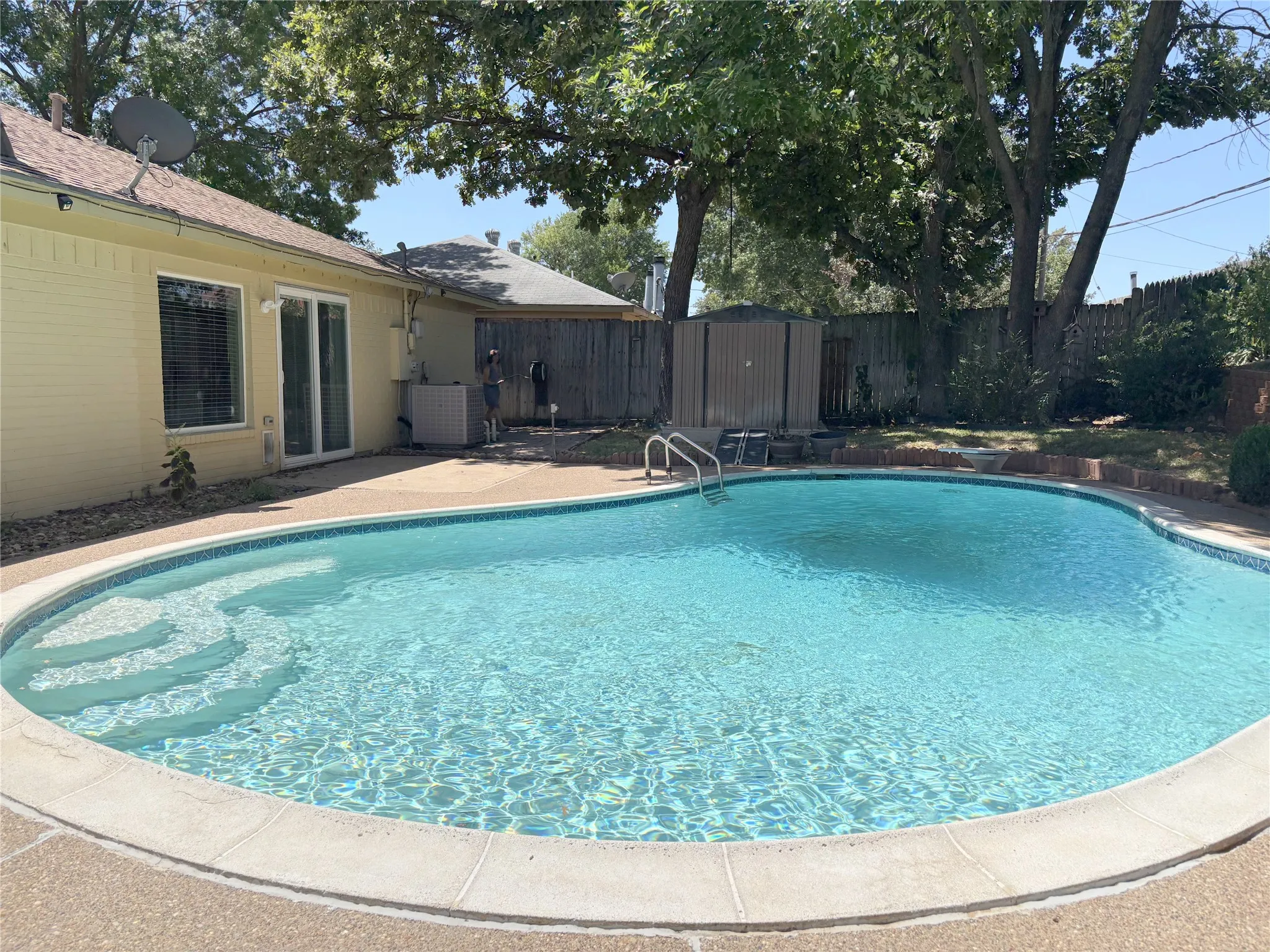 Large & beautiful backyard diving pool, plus a convenient mounted 10 x 10 storage shed.
