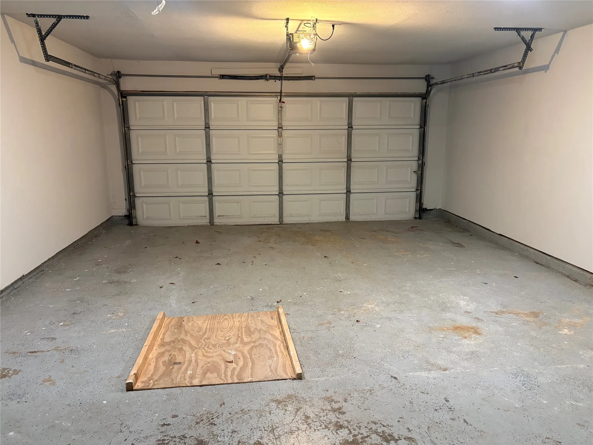 The two car garage includes a ramp at the end for accessability.