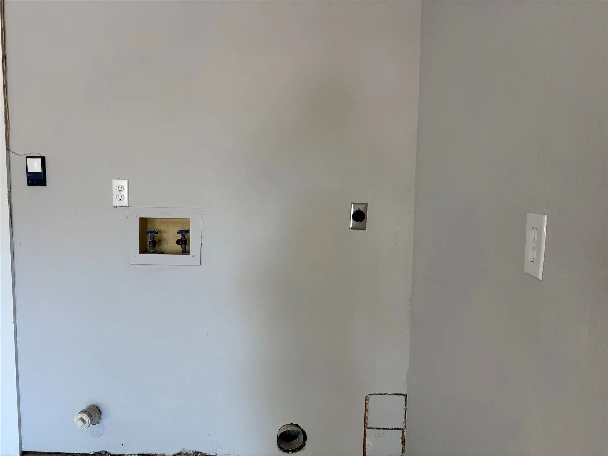 The utility area is conveniently located just inside the finished garage.