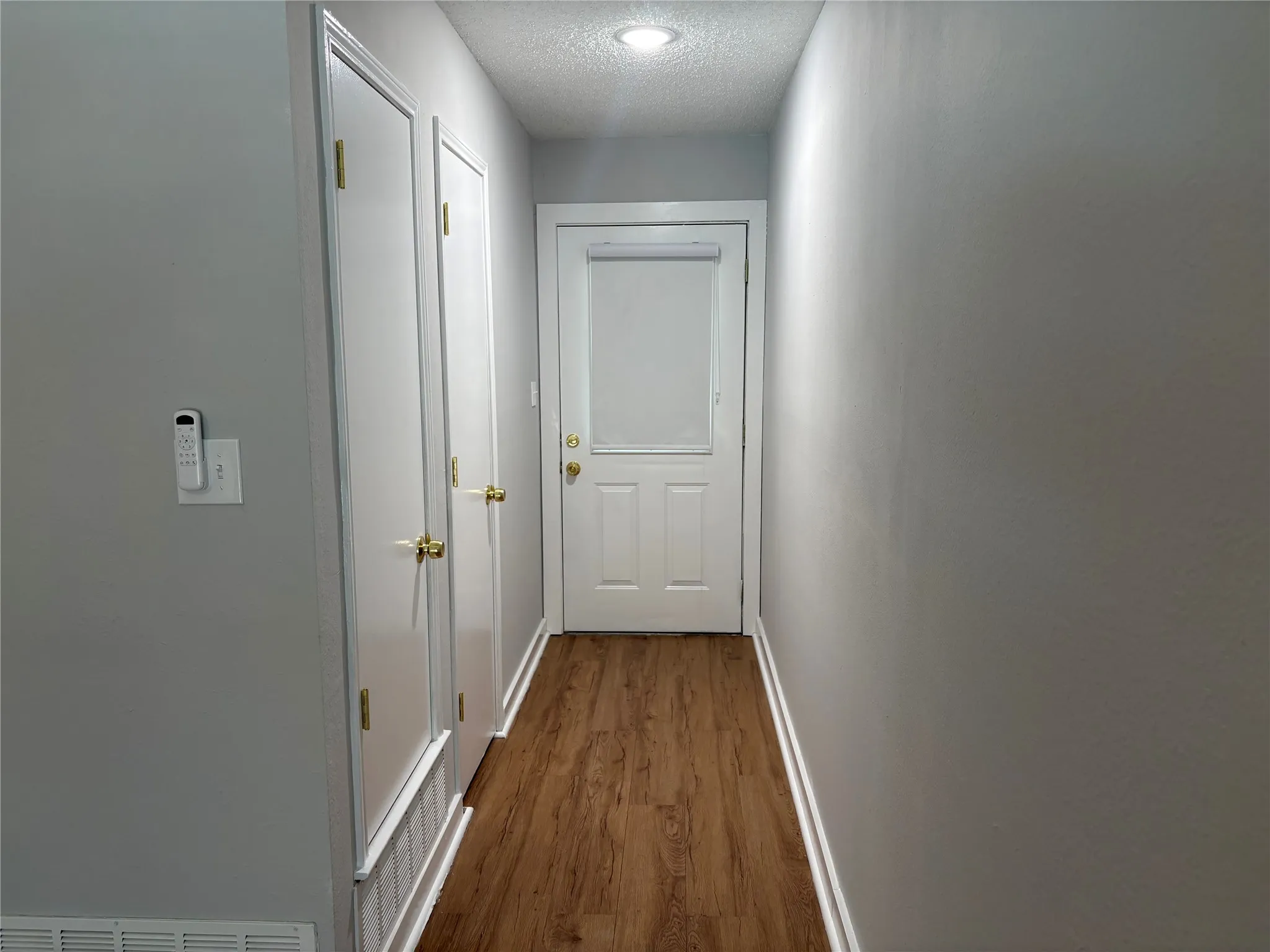 the entry hallway includes a coat closet, and opens to the living room.
