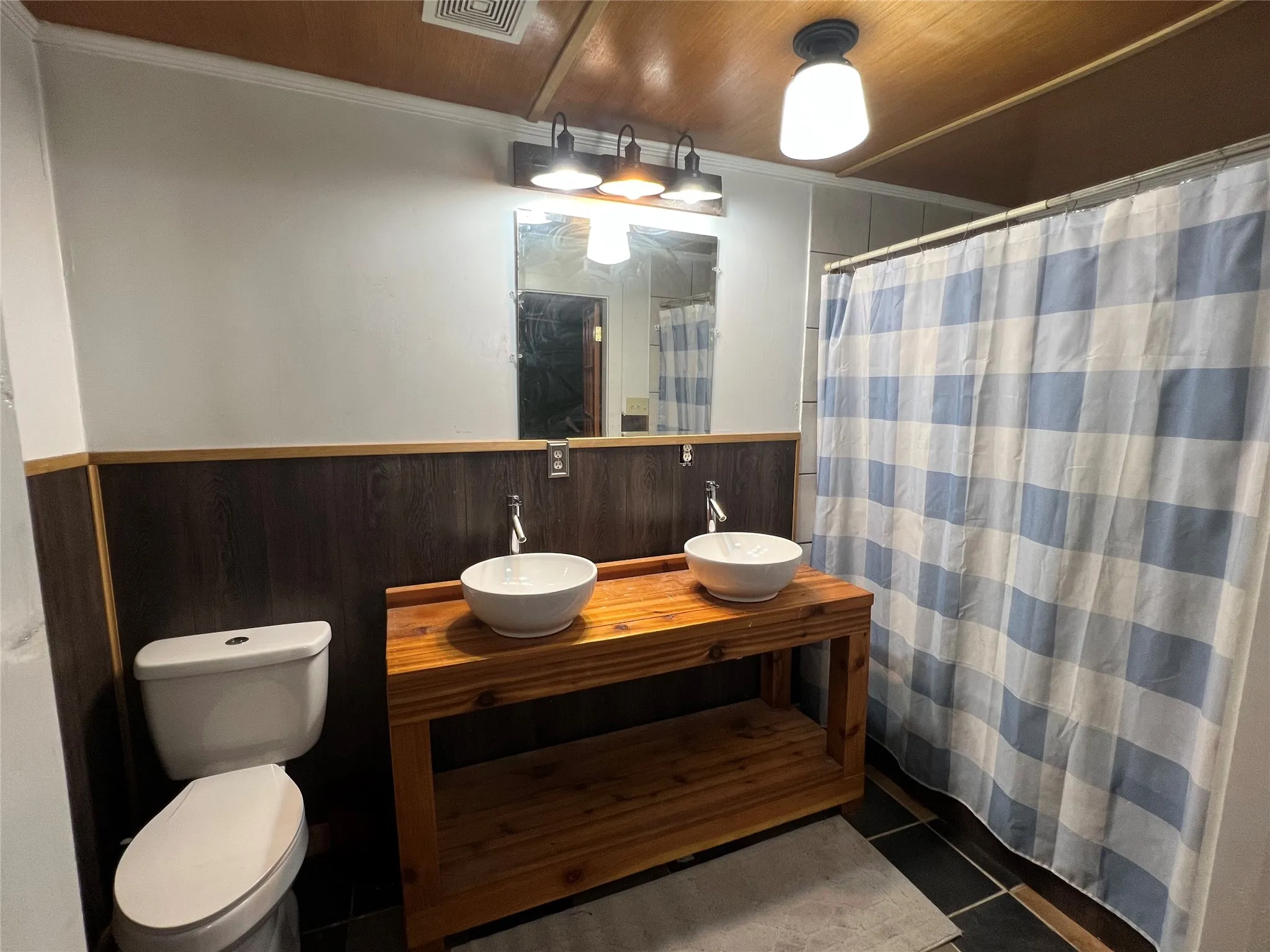Primary bathroom with dual sinks and updated shower