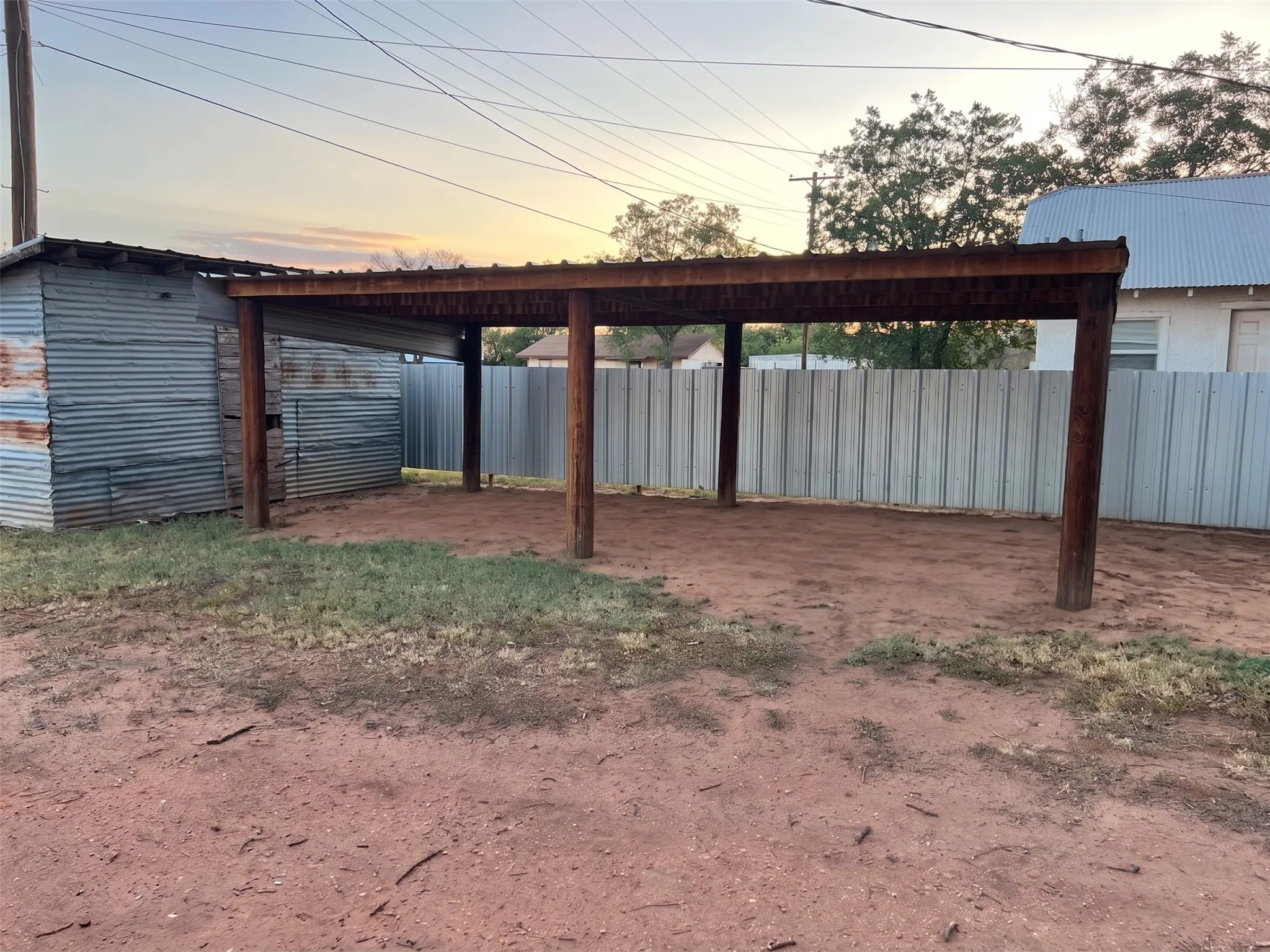 Backyard Carport and storage shed.