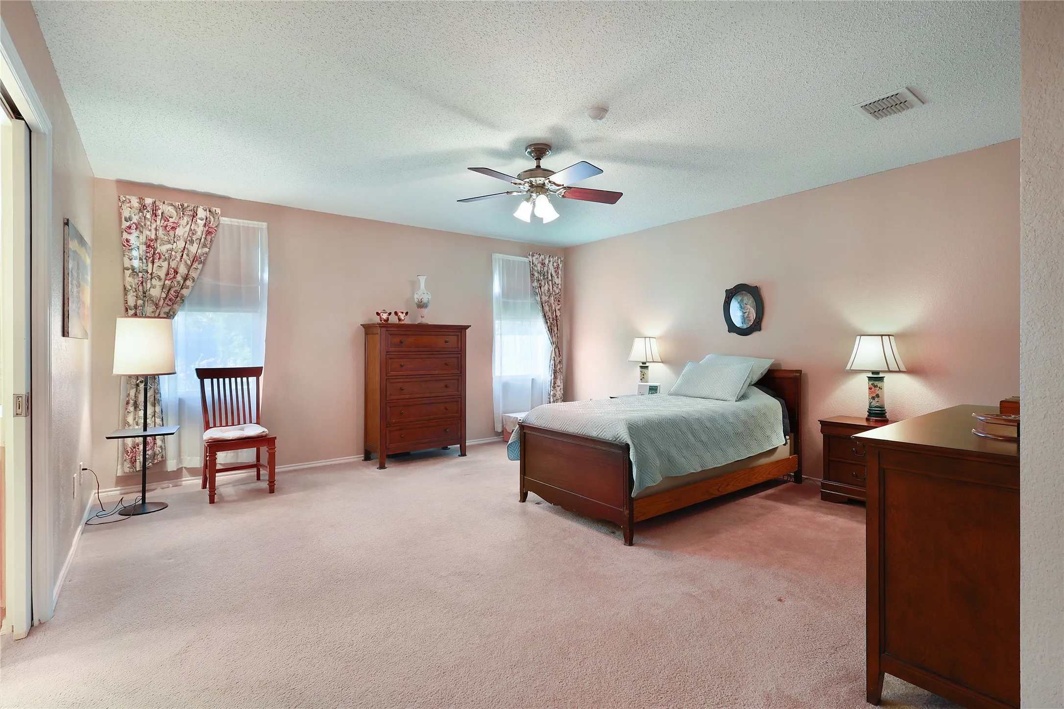 Recessed lighting, ceiling fan, and carpeted flooring