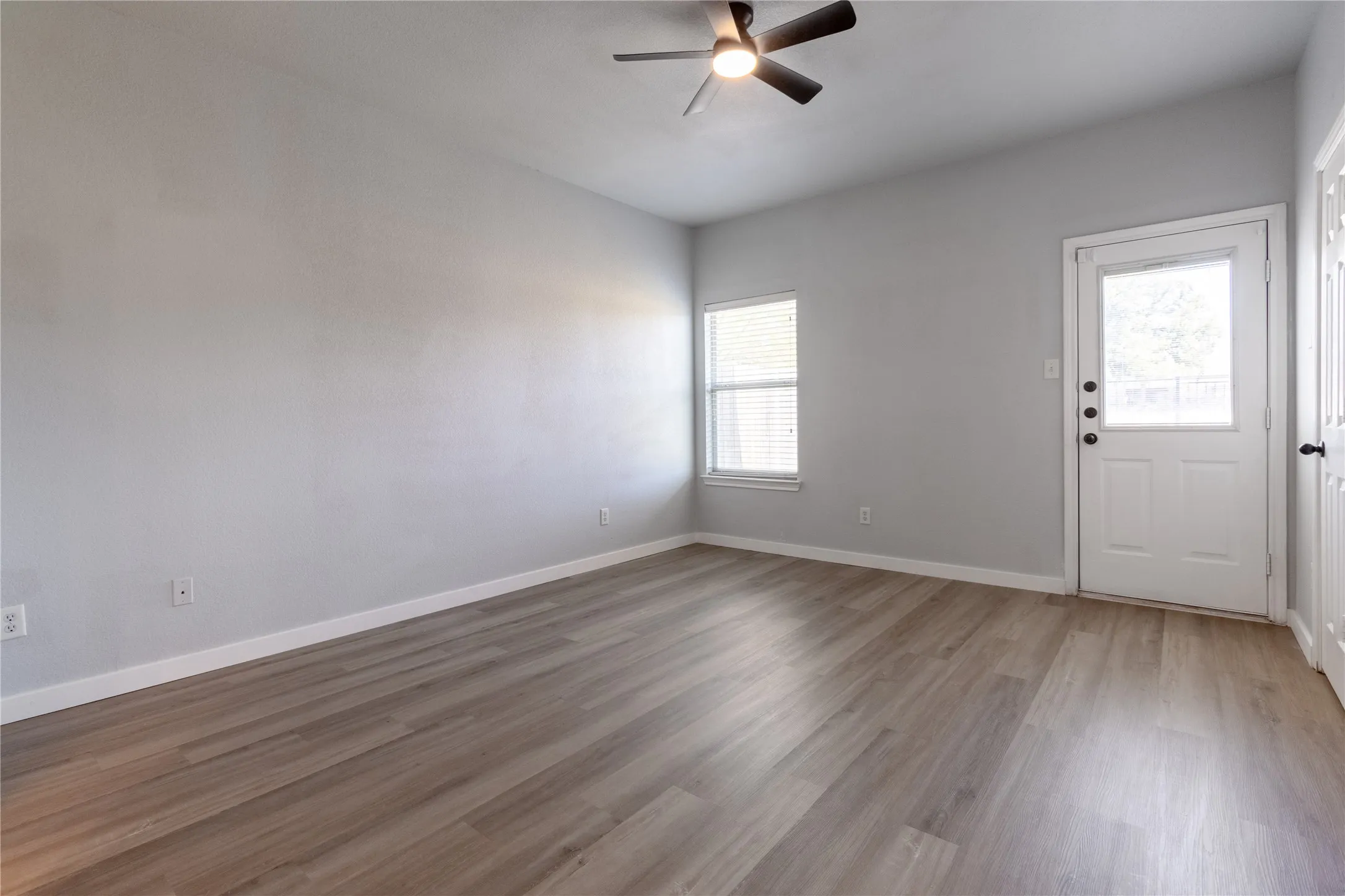 Primary bedroom with access to the backyard