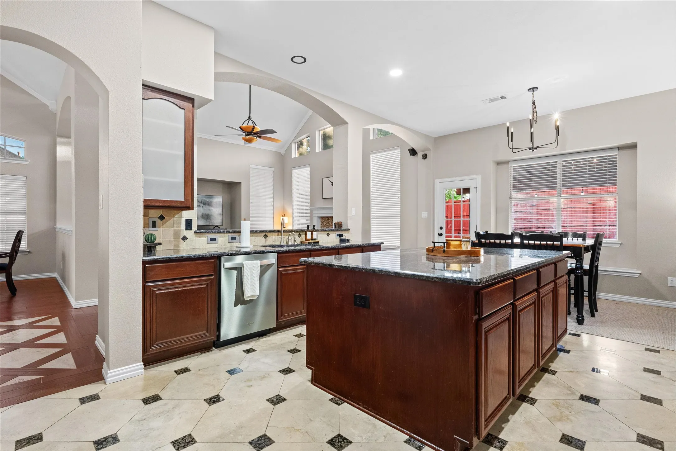 Kitchen overlooks living areas and great view of the backyard oasis through the window.