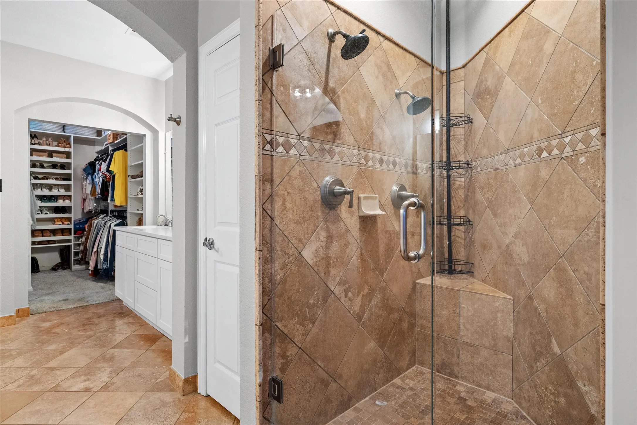 Luxury primary suite amenities include a walk in shower with dual shower heads and walk in closet.