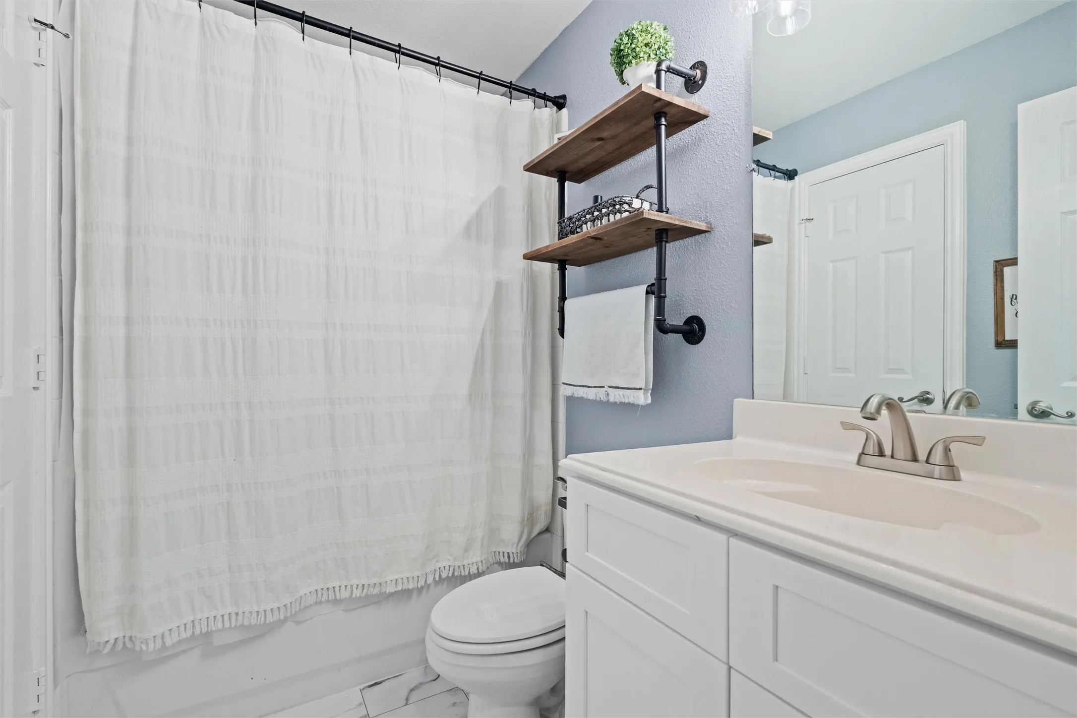 Upstairs hall bath updated with new cabinet July 2026