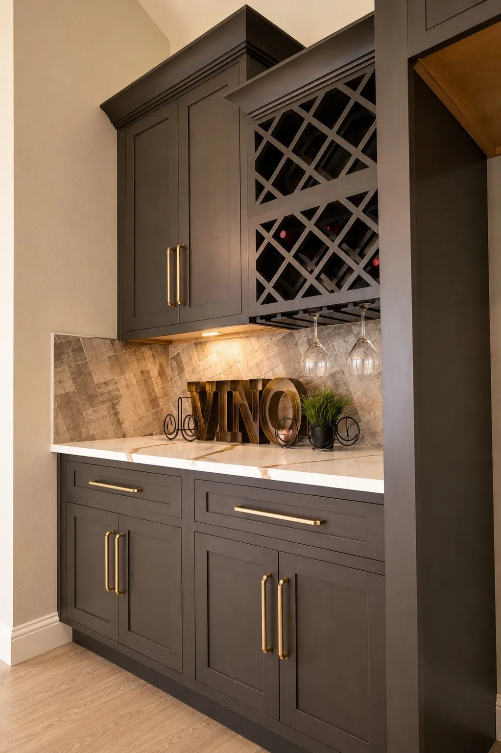 Custom cabinetry with gold-tone hardware, integrated wine rack, and stemware storage