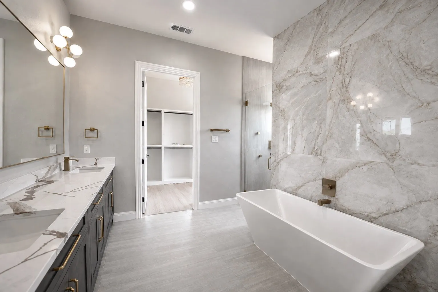 Dual vanity with integrated sinks and gold-toned hardware