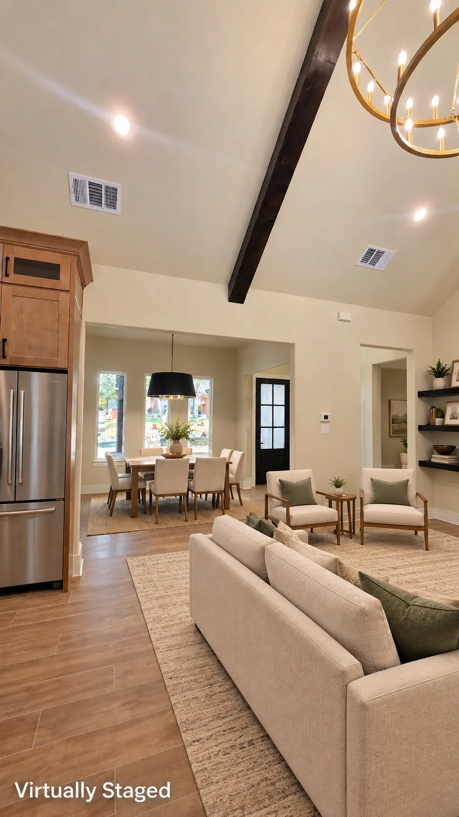 Vaulted ceiling with exposed wood beam, recessed lighting, and wood-finish flooring