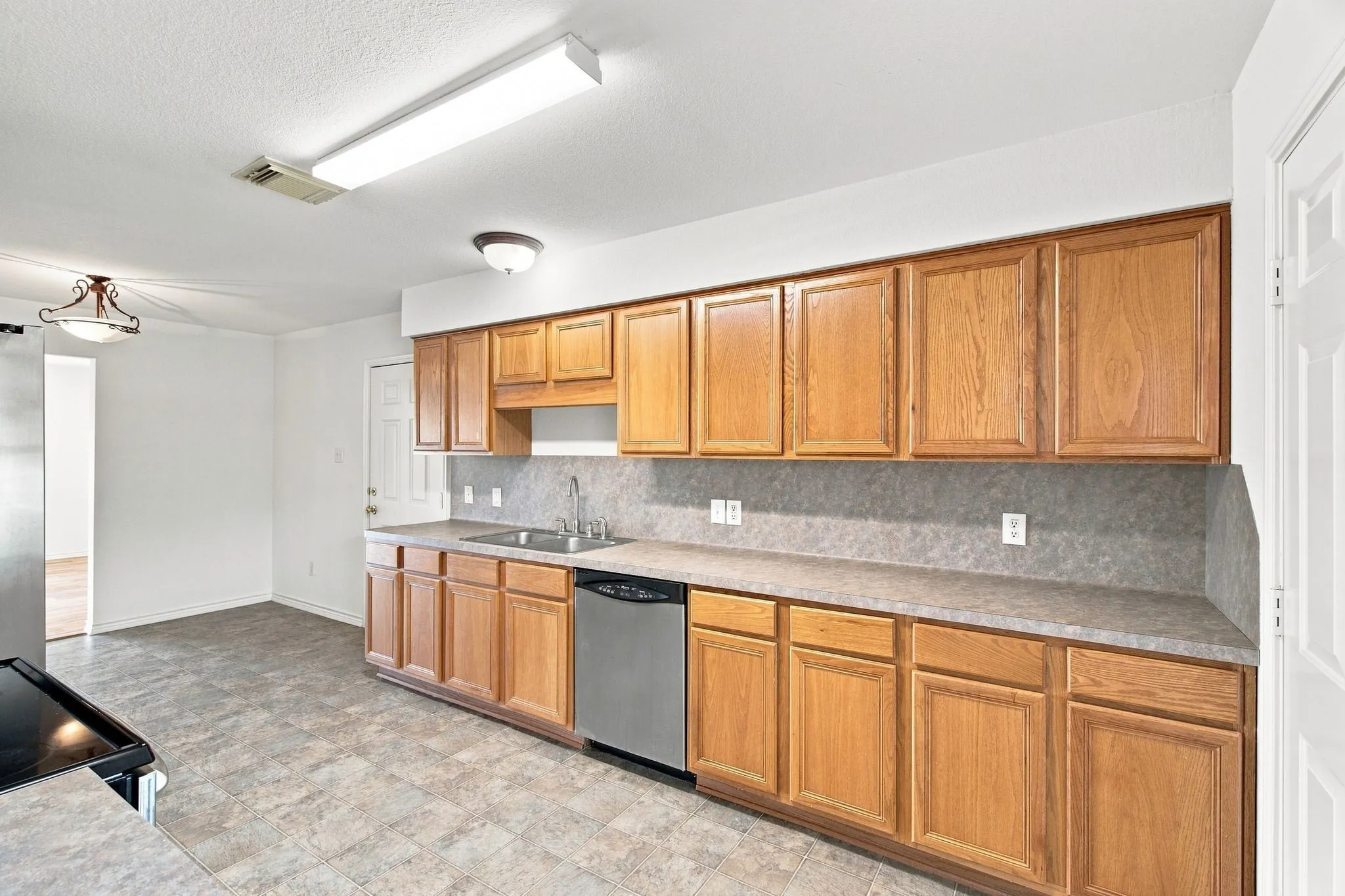 Hugh kitchen with tons of cabinets and counter space