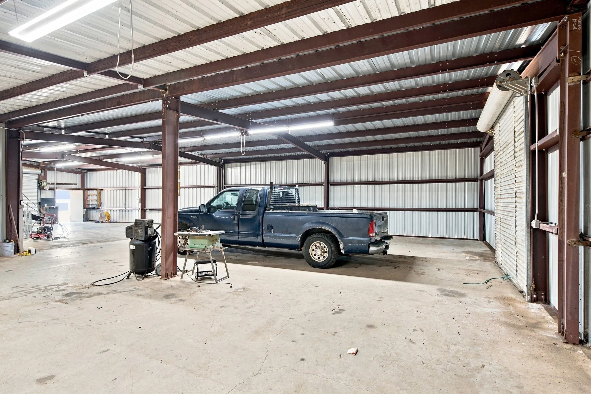 Other side of workshop with door leading to livestock area