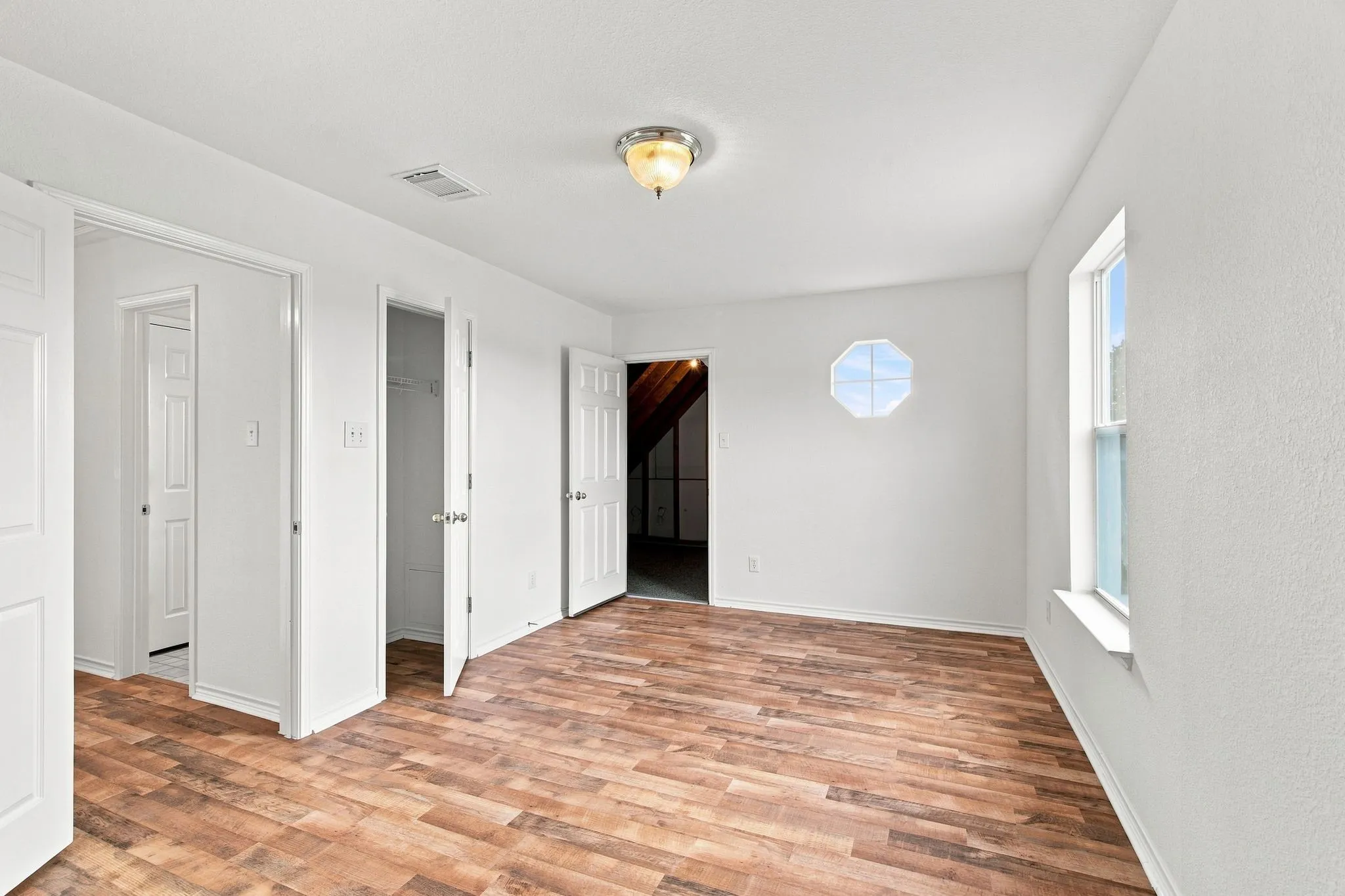 3rd bedroom with walk-out door to attic