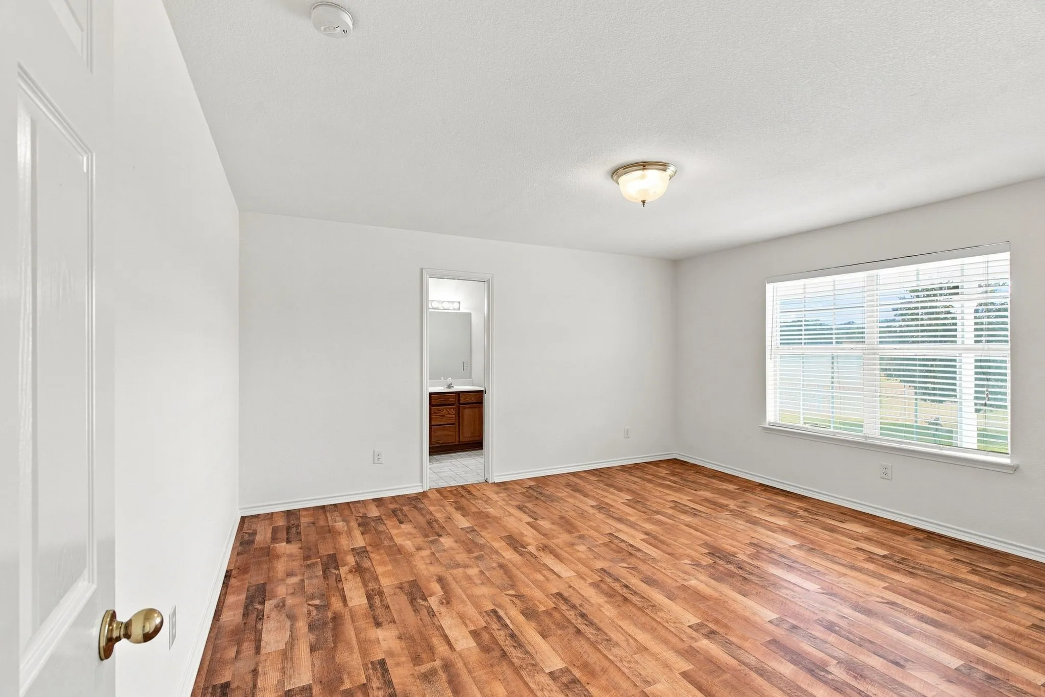 Primary bedroom with awesome views overlooking the property