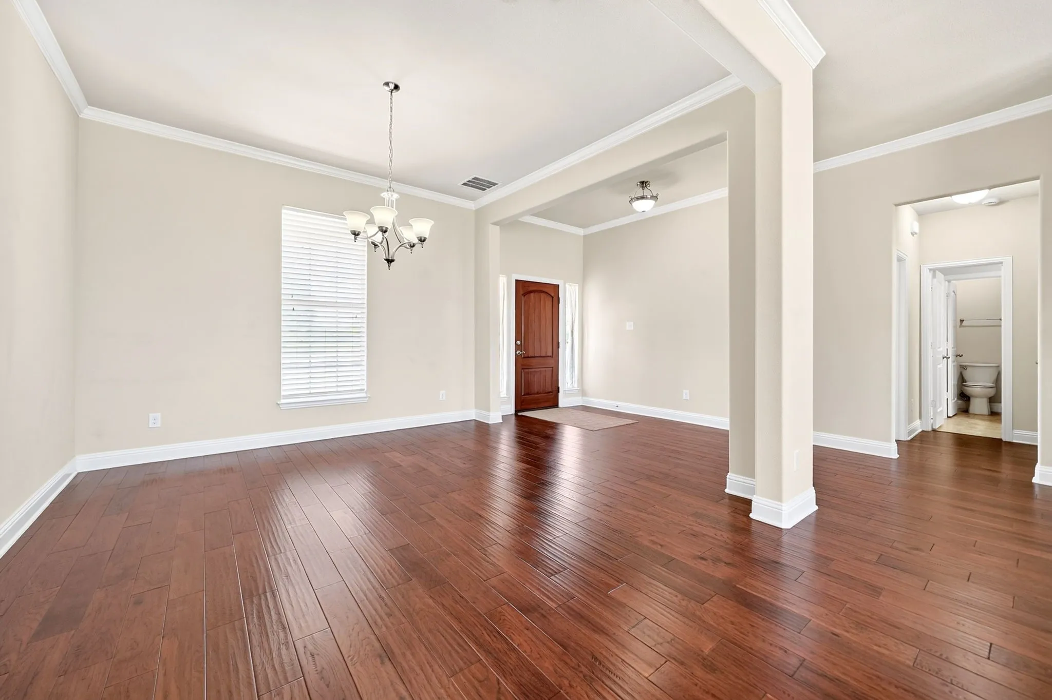 Formal dining or living area located immediately to the right of the entrance.