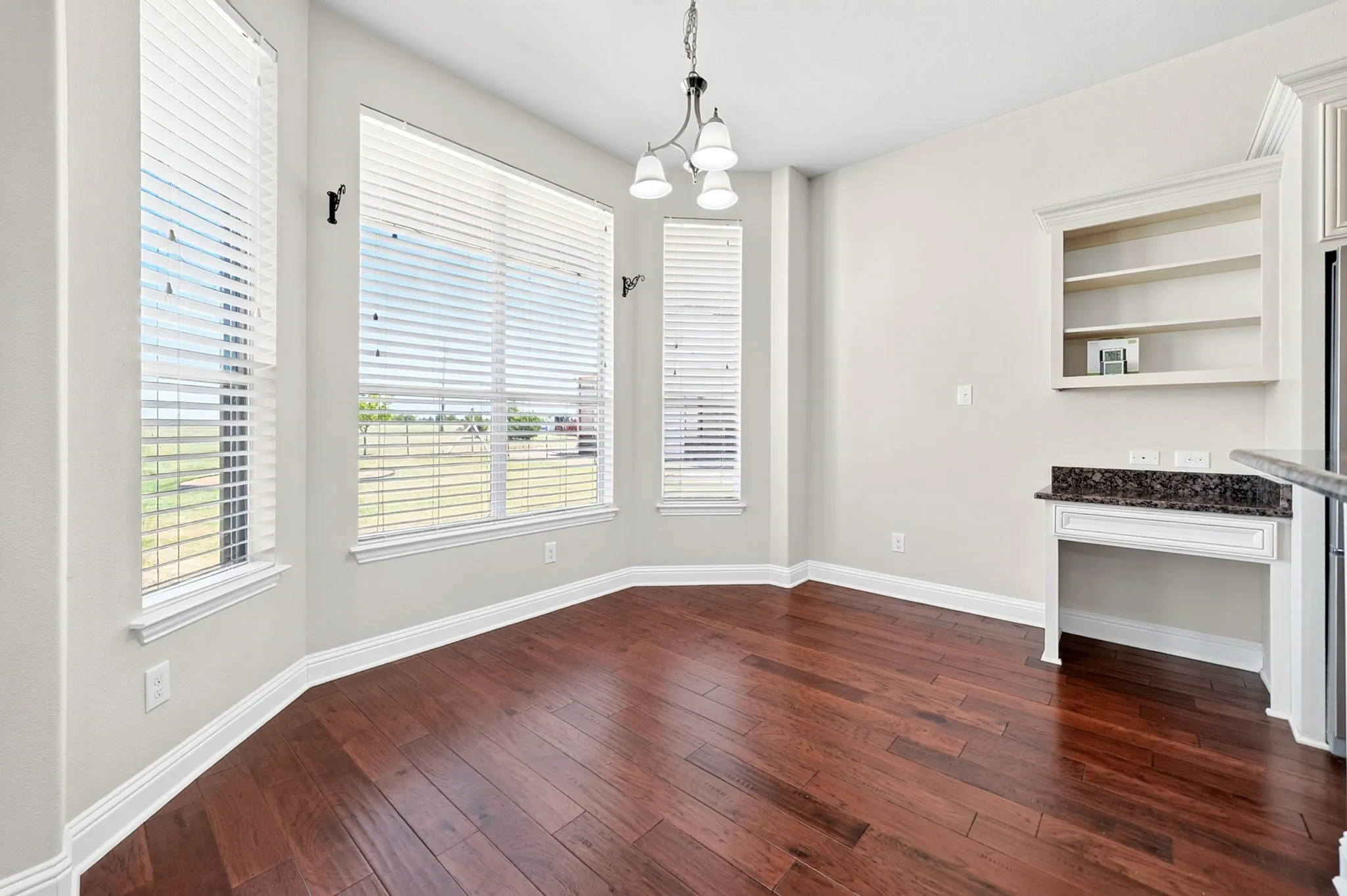 Beautiful bay window overlooking the acreage, located to the left of the kitchen.