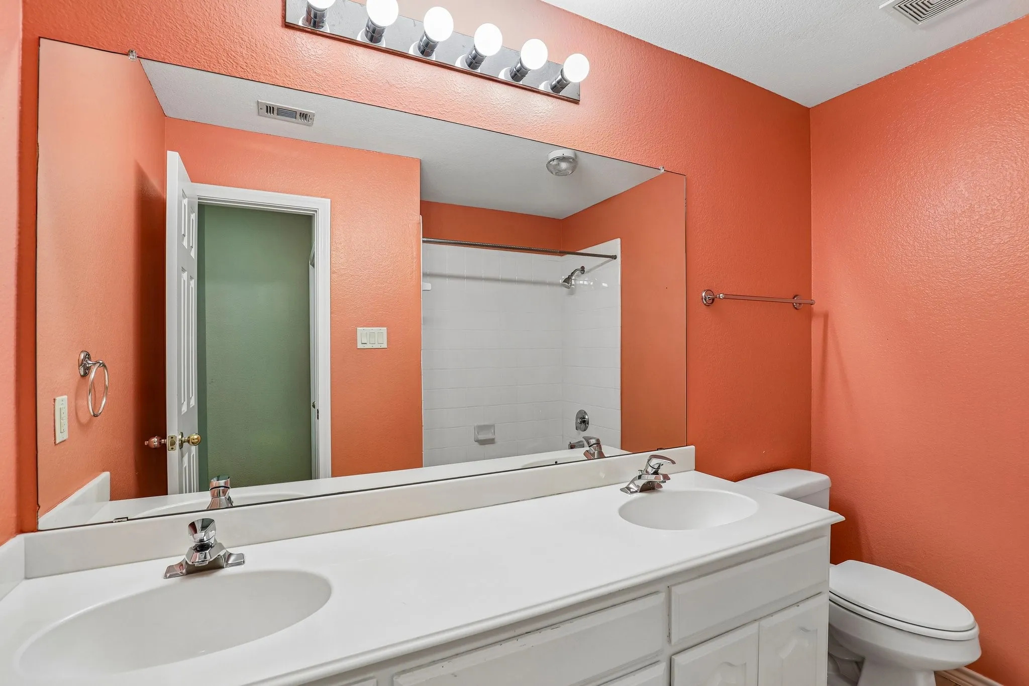 Upstairs full bath with dual sinks.