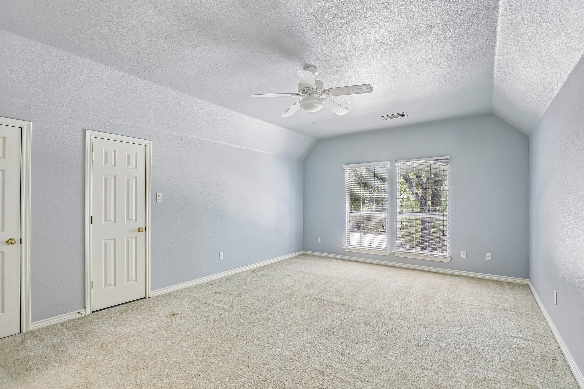Game room with storage closets and natural light.