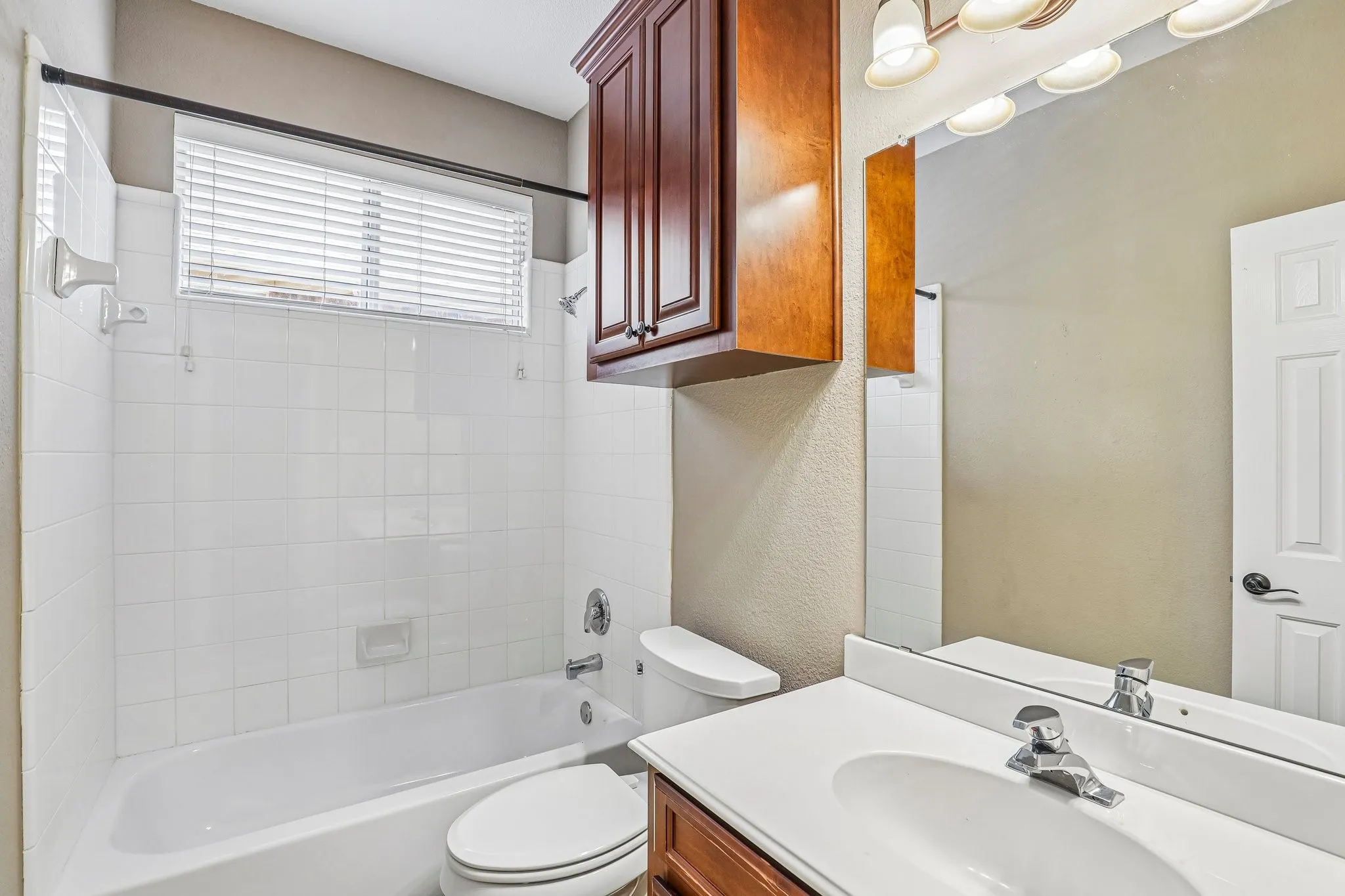 Secondary downstairs full bath with tub/shower combo.
