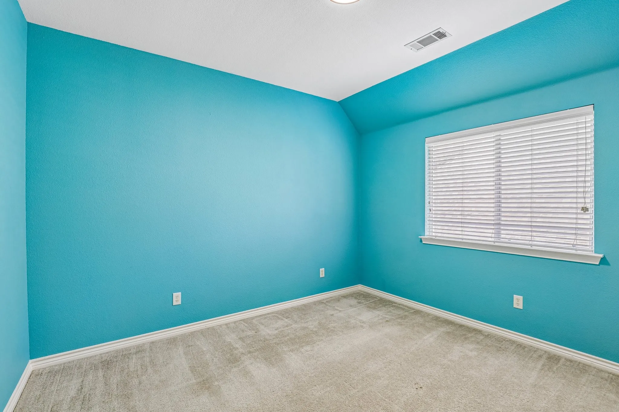 Upstairs bedroom with natural light.