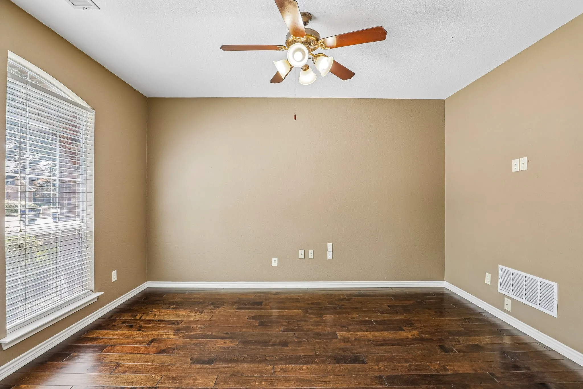 Dedicated office with ceiling fan.