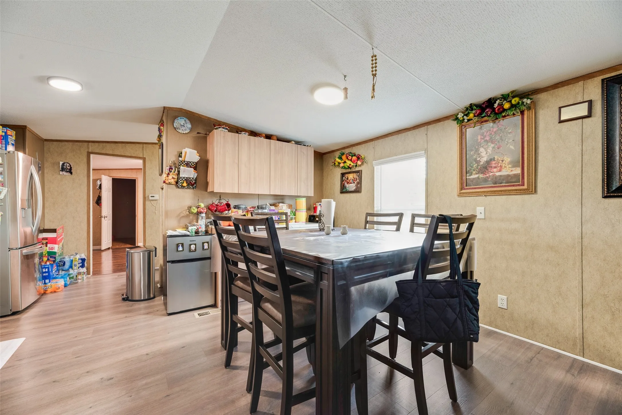 Wood-finish flooring throughout the space