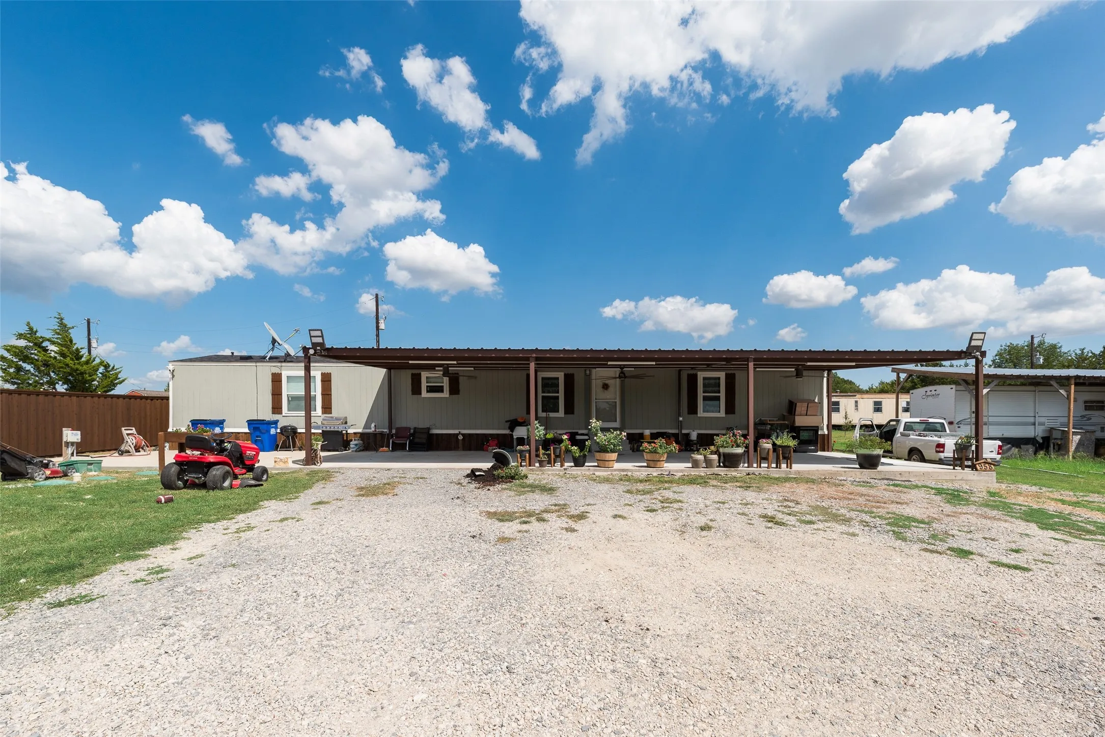 Manufactured home with an extended covered porch and metal roof