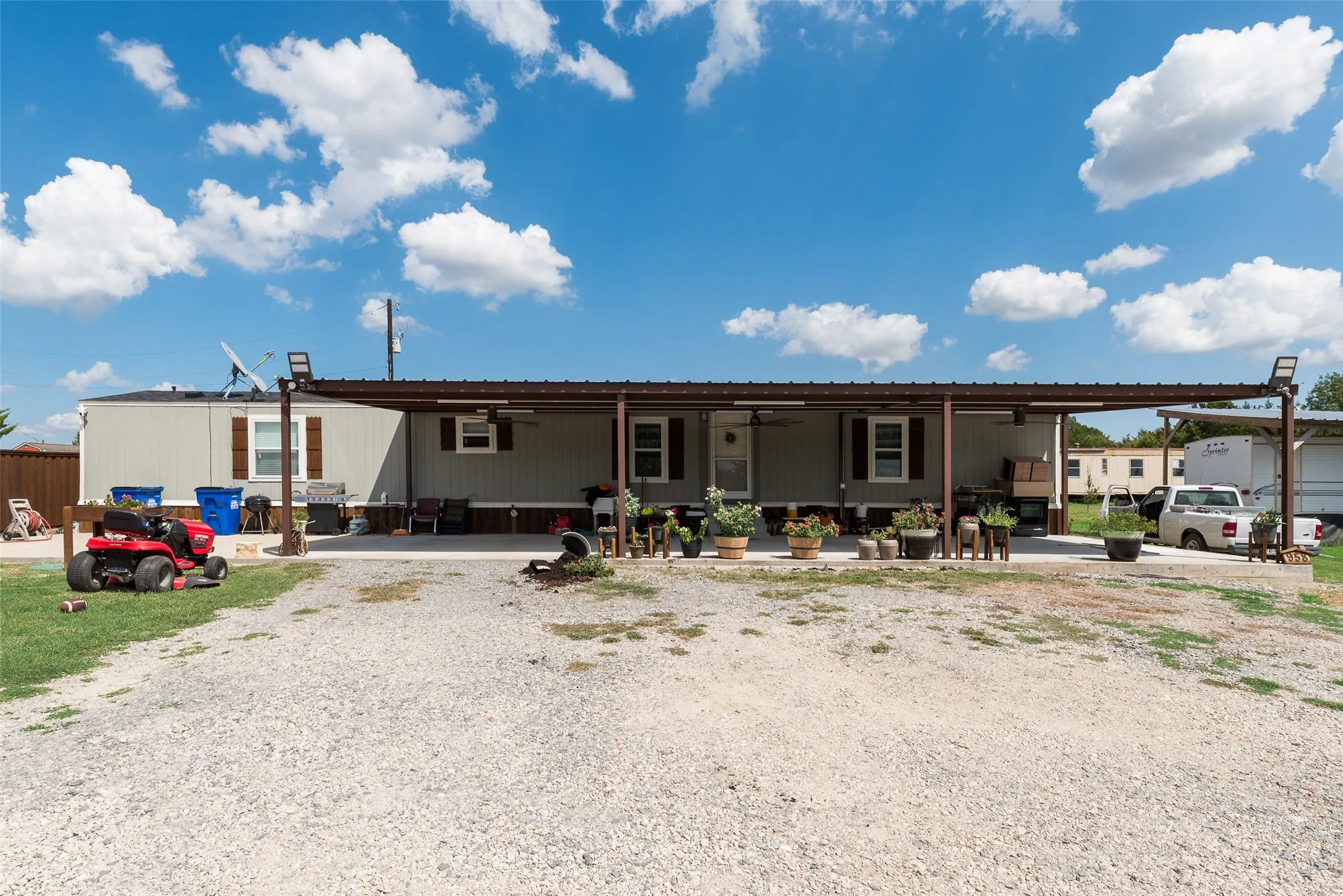 Expansive gravel driveway providing ample parking