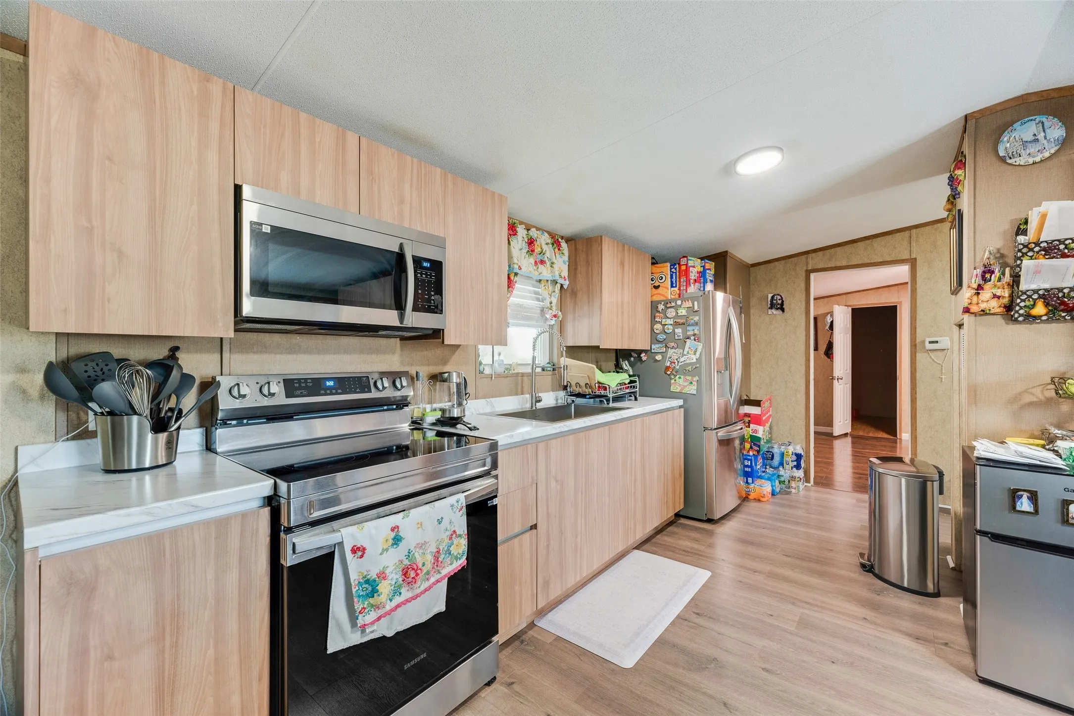 Wood-finish cabinetry paired with white countertops