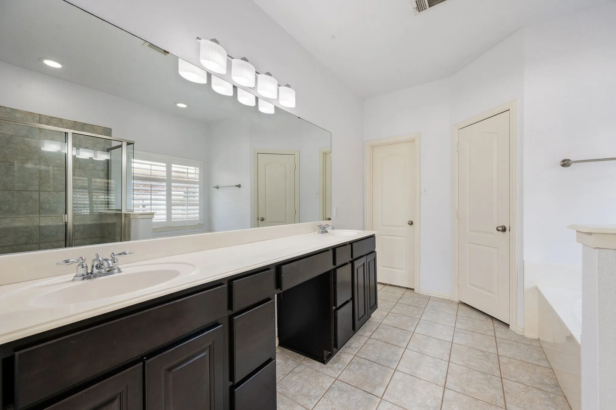 Spacious Primary Bathroom with dual sinks.