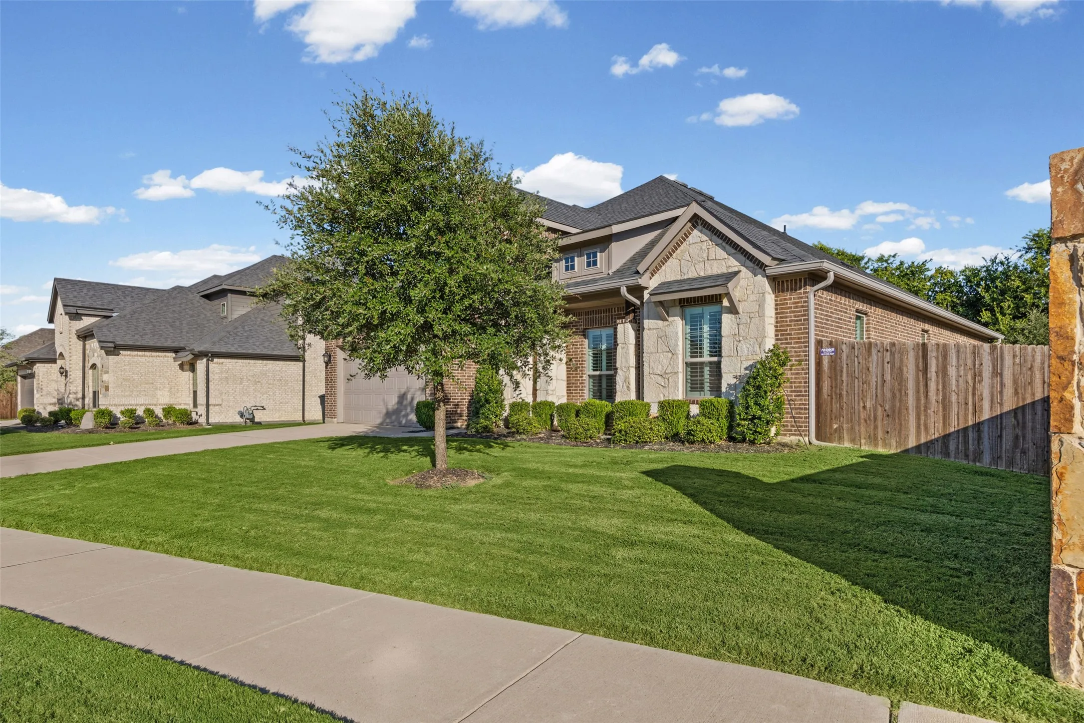 Great curb appeal with only one next door neighbor and green space behind